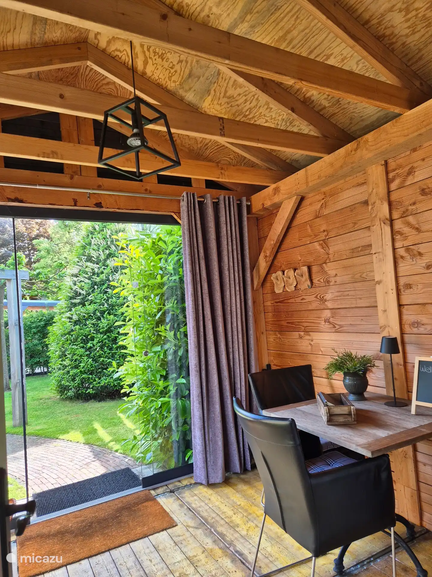 Sit comfortably in the conservatory overlooking the garden 