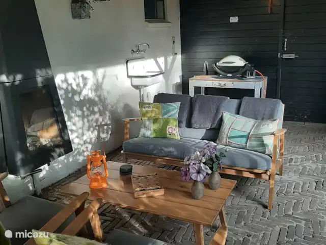 casa vacacional en Países Bajos, Güeldres, Dodewaard – La nuez diminuta Asiento junto a la estufa de leña