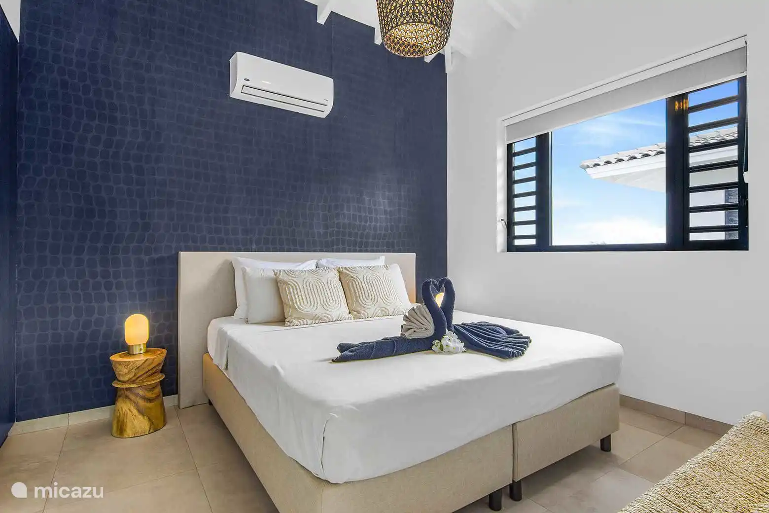 Dormitorio 1 con aire acondicionado y baño privado