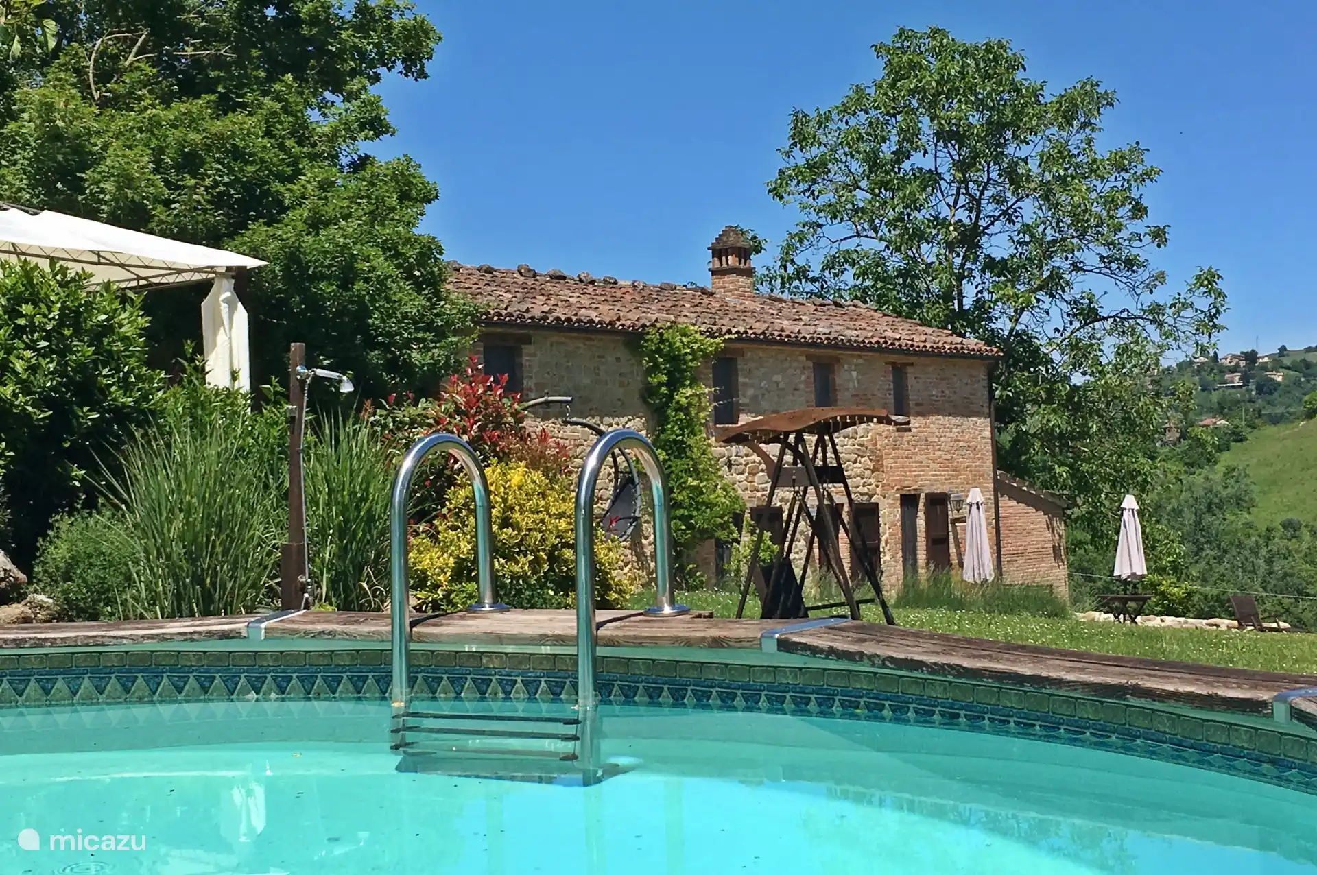 Looking from the Pool. Valley View apartment is upstairs in the old farmhouse.