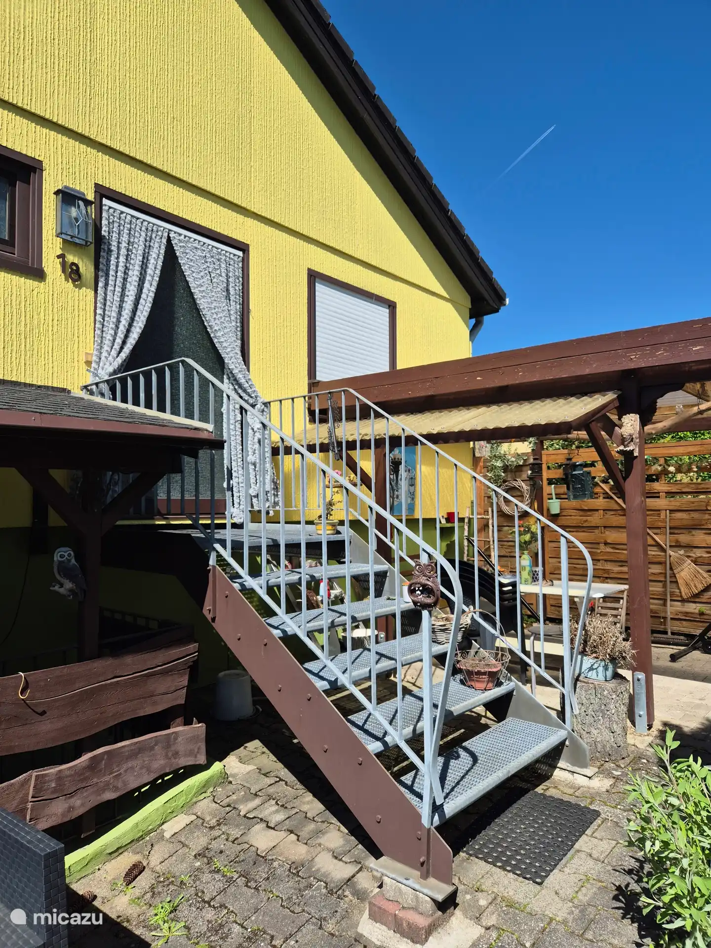 metal access stairs to the front door