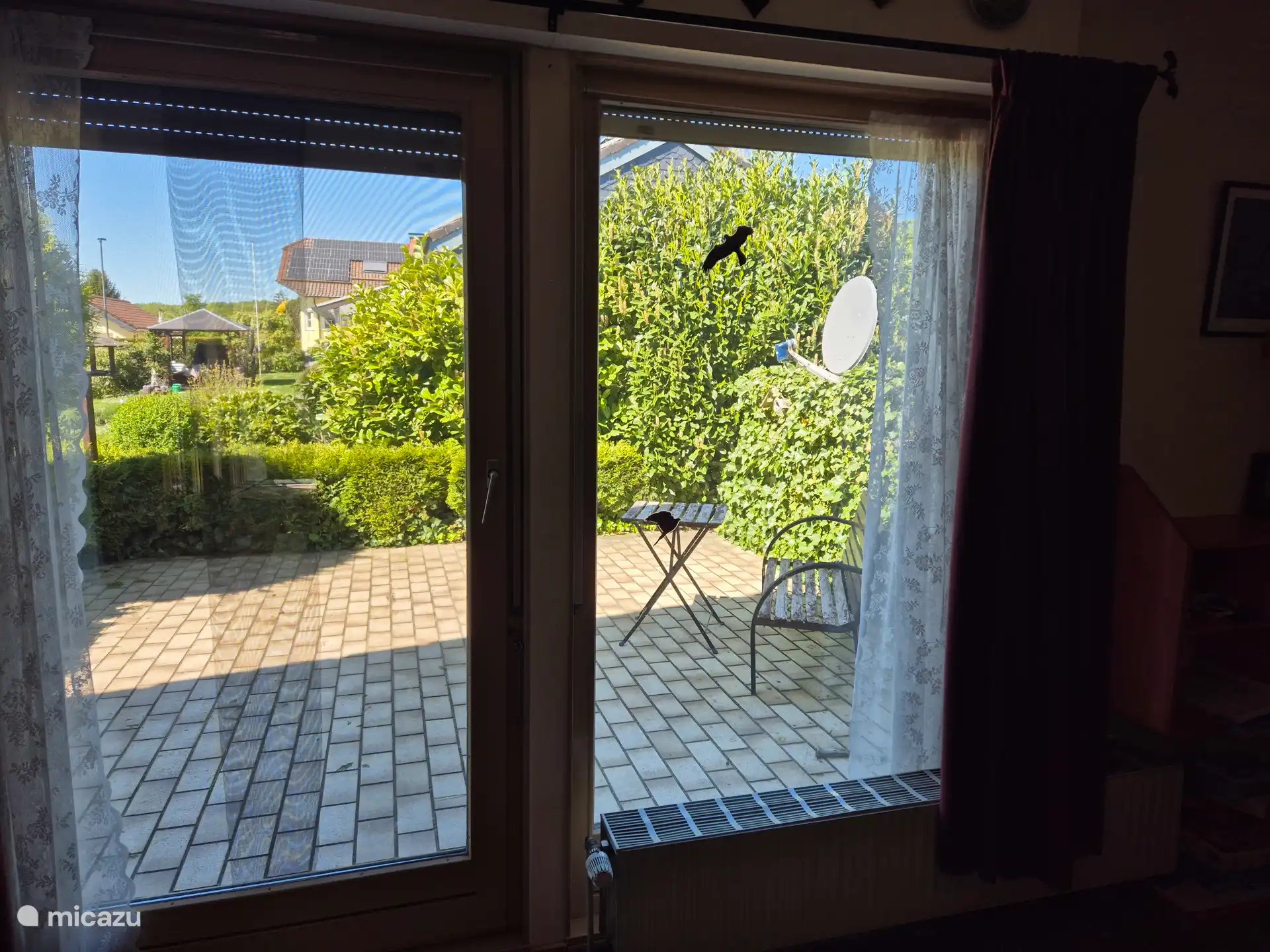 Sun terrace accessible through patio doors in the living room and also through the garden.  Lovely evening sun.