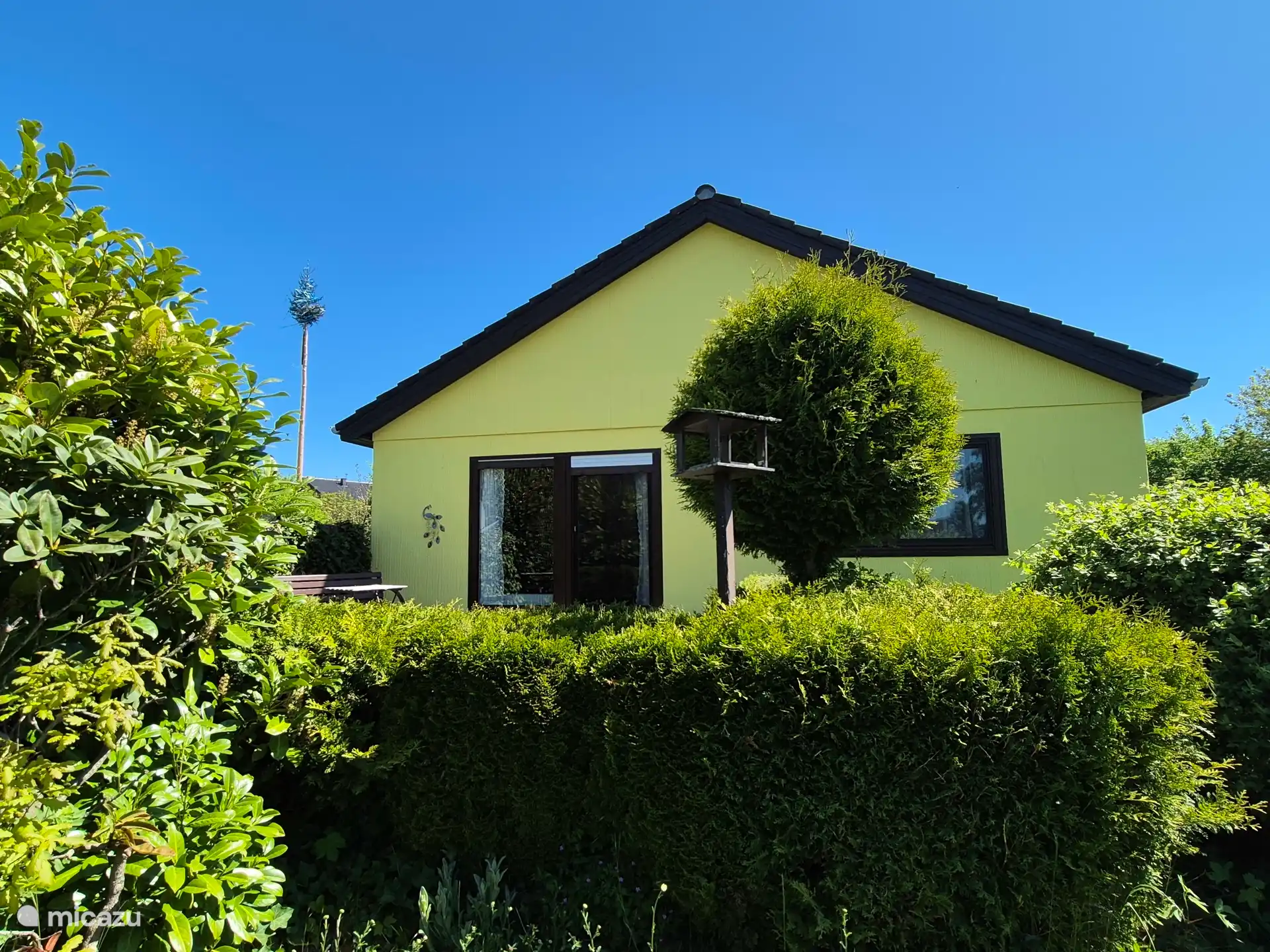 Cottage from sunny terrace side.