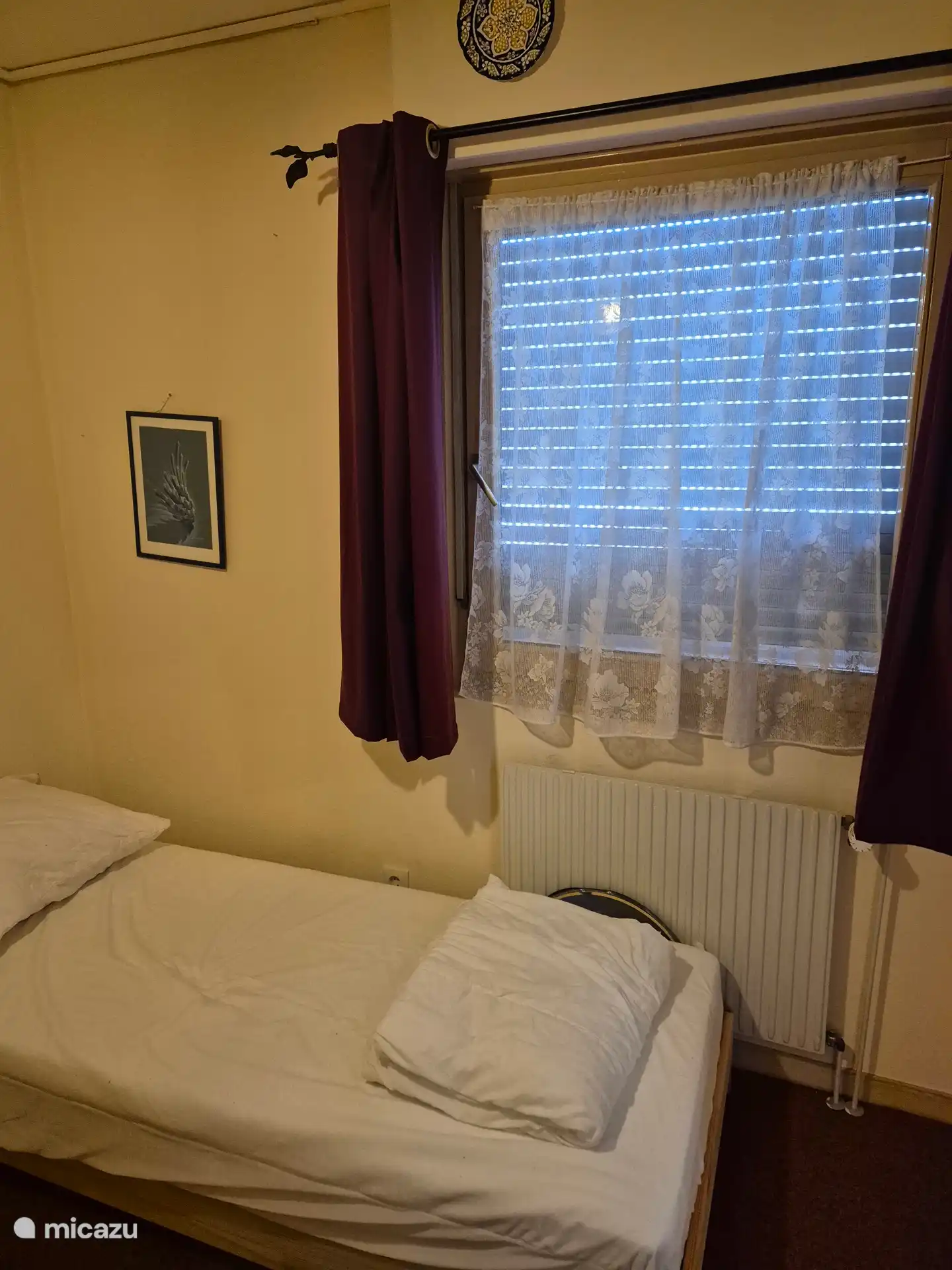 Tilt window in 2nd bedroom. View of the garden.