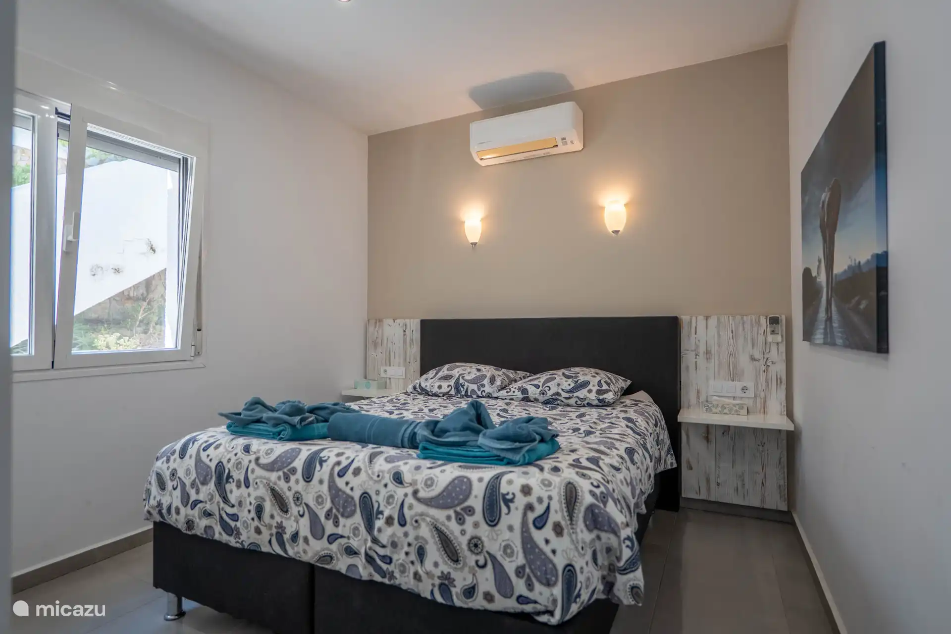 The bedroom on the ground floor has a double bed and spacious wardrobe.