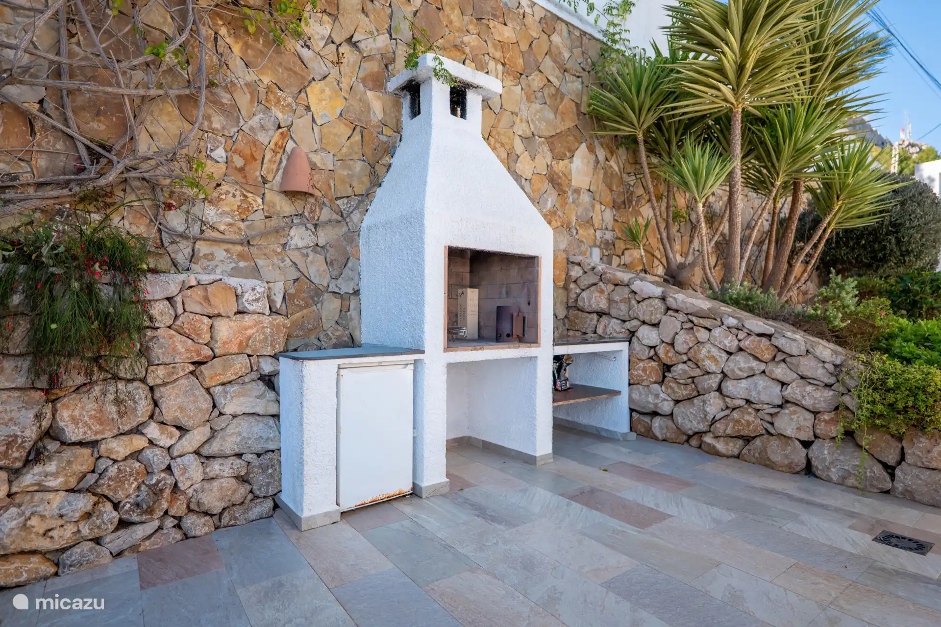 Further on you will find the spacious outdoor barbecue for cooking outside.