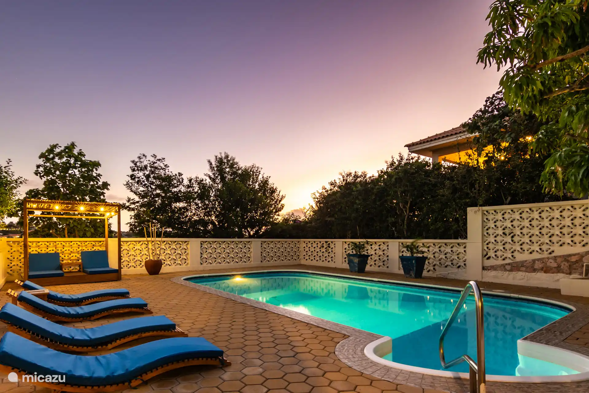 Sunset pool with sunbeds