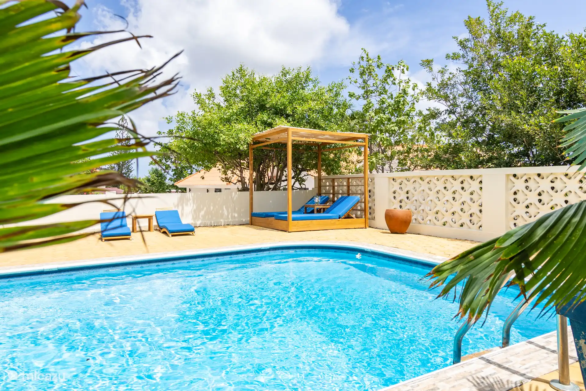 Swimming pool with luxury sunbeds.