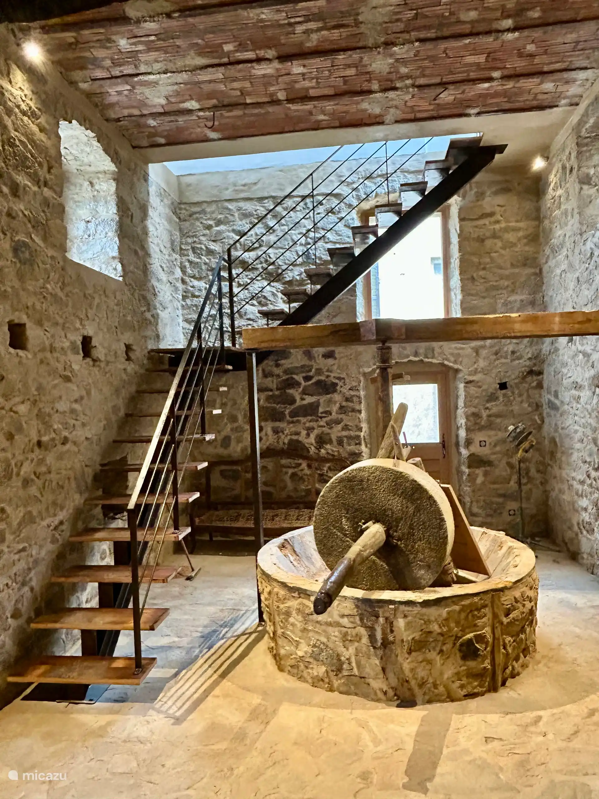 Old oil mill renovated in 2025, staircase leading to the kitchen