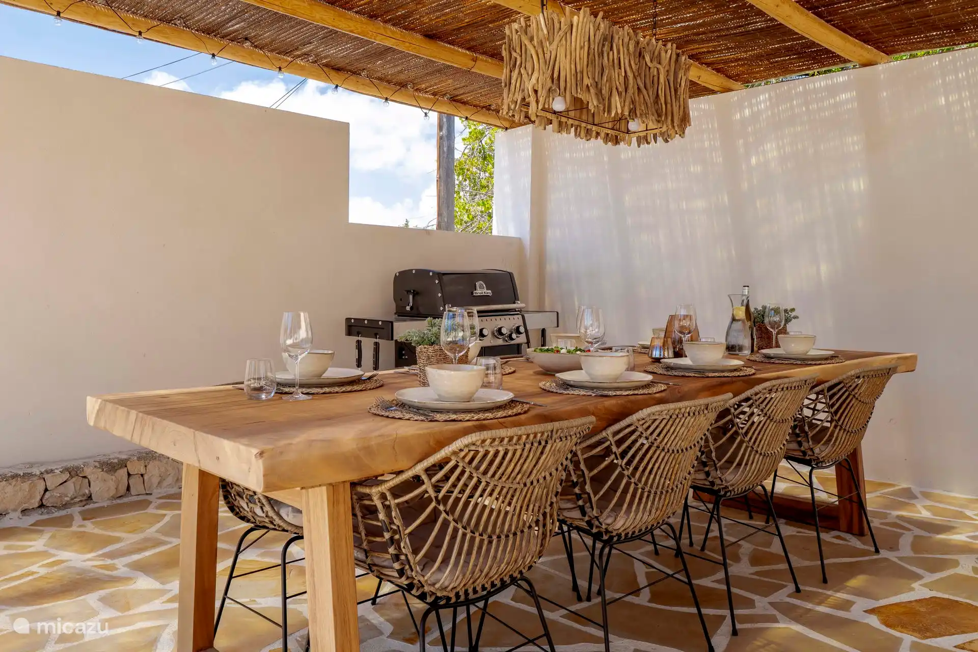 Enjoy a cozy meal, comfortably under the stylish veranda.