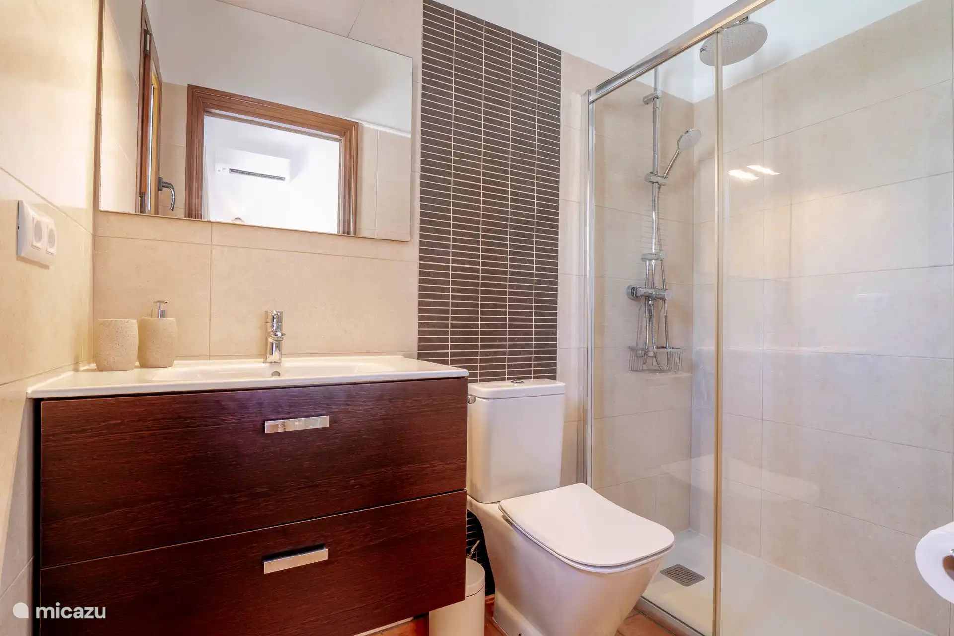 The 3rd bathroom is located in the guest house.