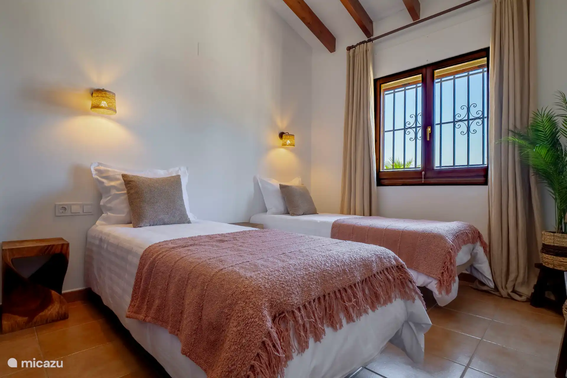 Bedroom 1 with 2 separate beds and air-conditioned.