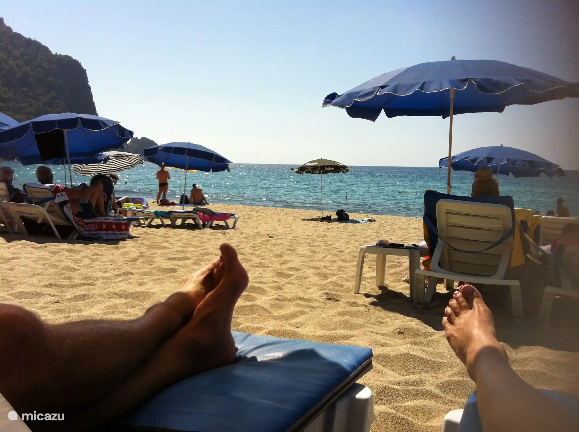 And then under the mountain the feet in the sand. A stone's throw from all the bazaars and the busy life of Alanya.