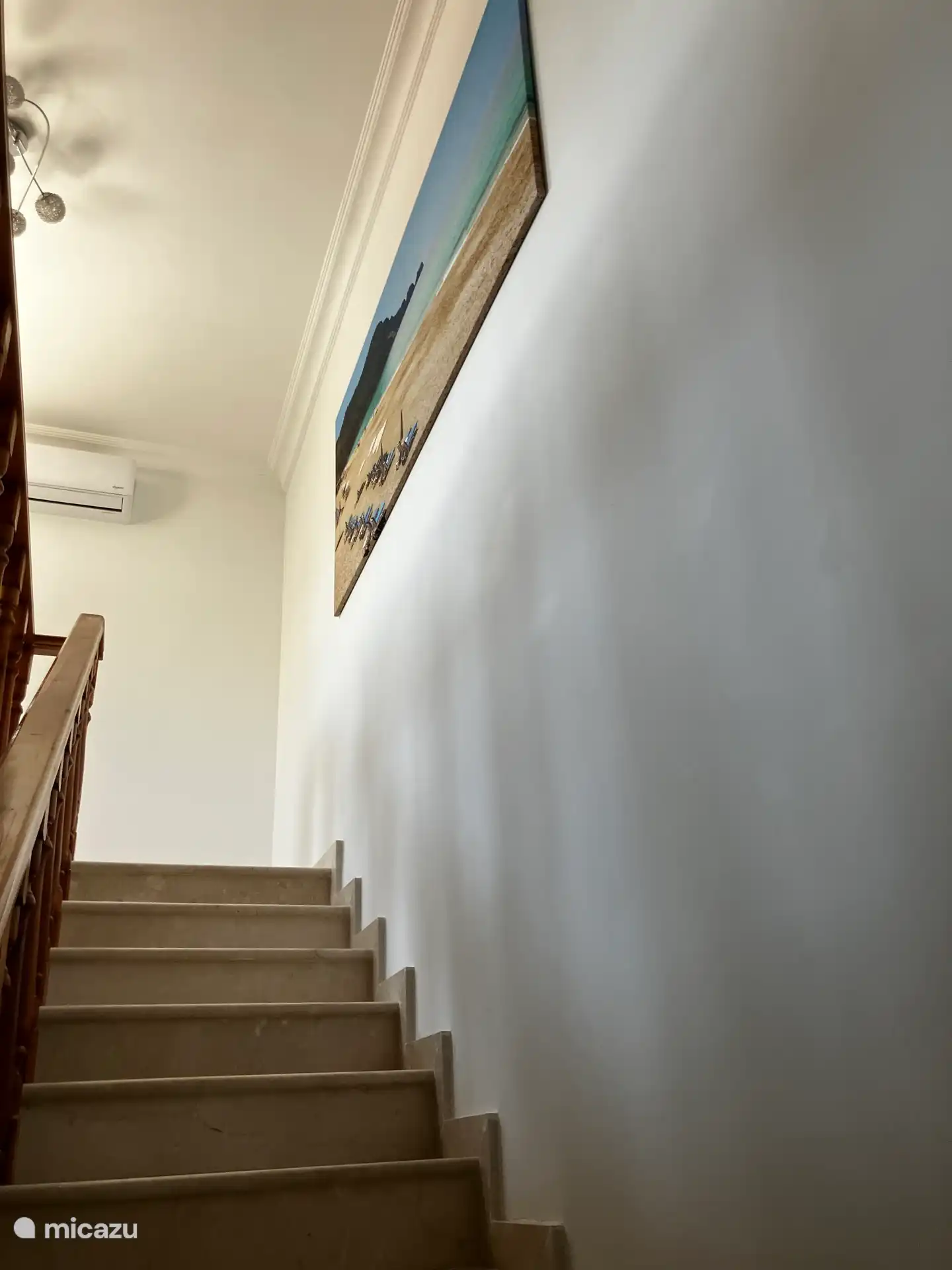 Opposite the bathroom is the staircase to the second floor and the large roof terrace.