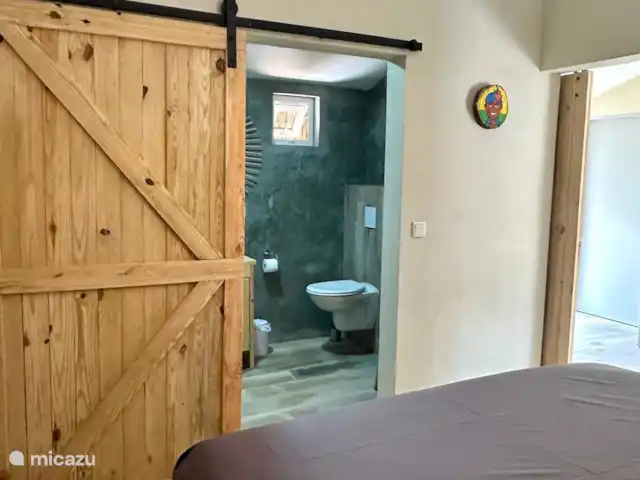 Kas Pelikan Privé  | Curaçao, Curaçao-Centre, Julianadorp - appartement Dans cette chambre douillette, vous pouvez choisir entre un lit double confortable ou deux lits simples, assurant une nuit de sommeil agréable pour tout le monde.