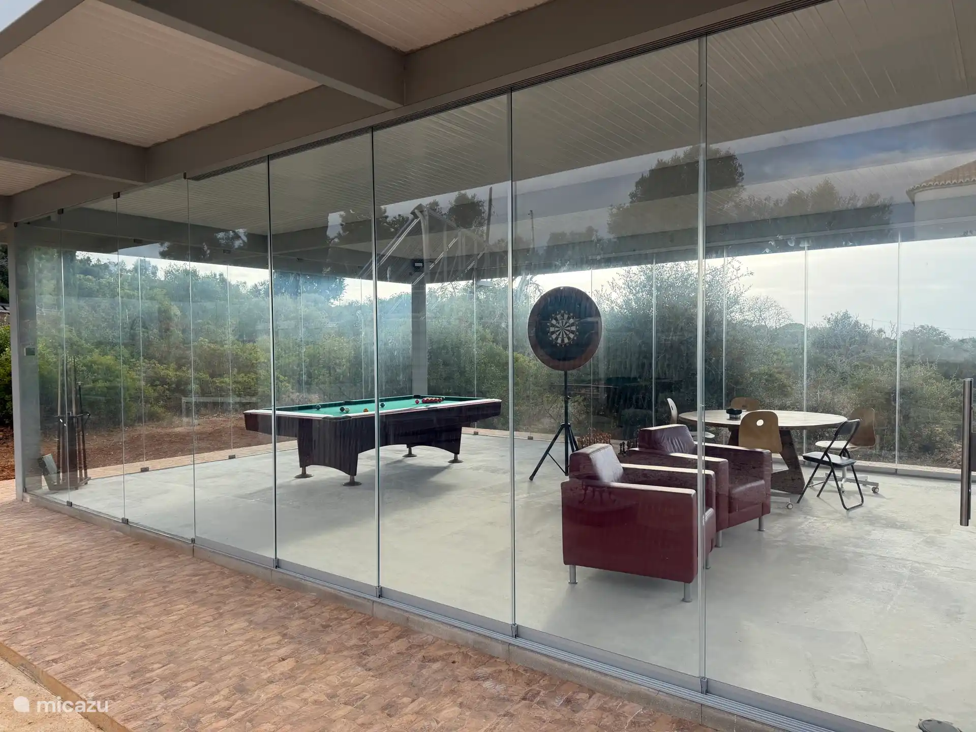 In the pavilion by the pool you can play chess, darts and snooker