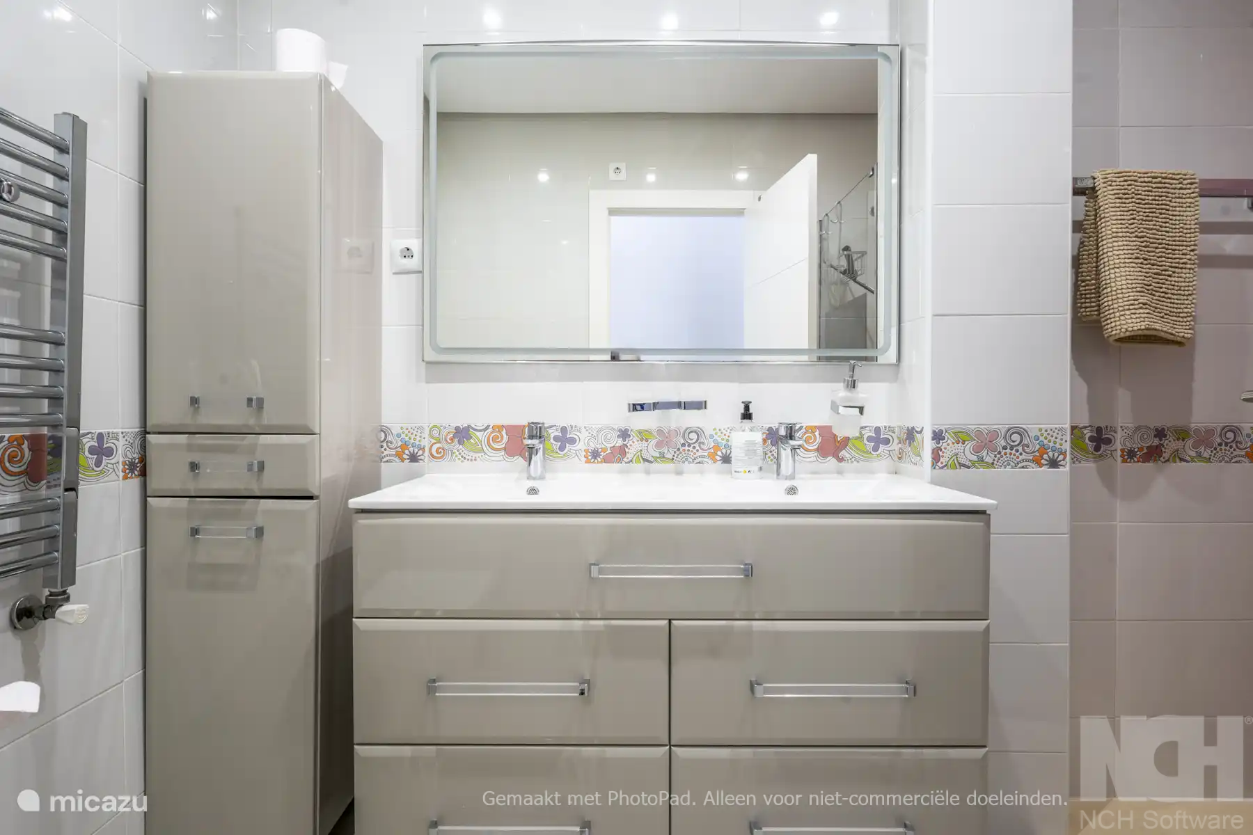 Bathroom 2 - double sink with extra space in high cupboard. Hair dryer is provided.