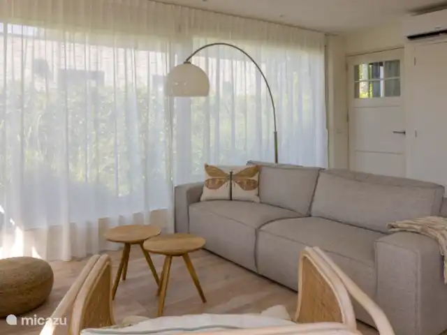 Chalet au bord de la plage avec piscine | Pays-Bas, Zélande, Baarland - bungalow Canapé confortable dans le salon