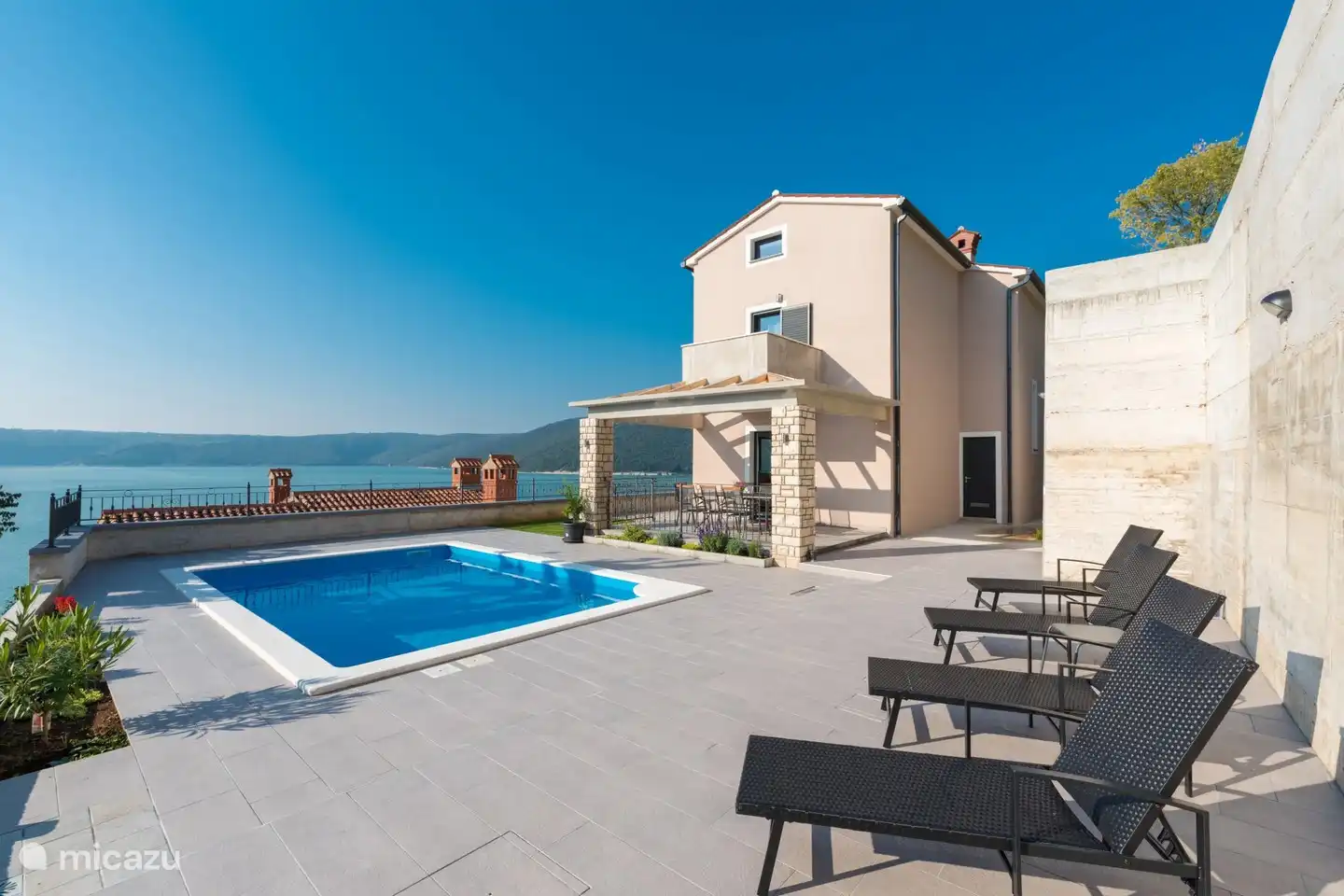 swimming pool and sunbeds