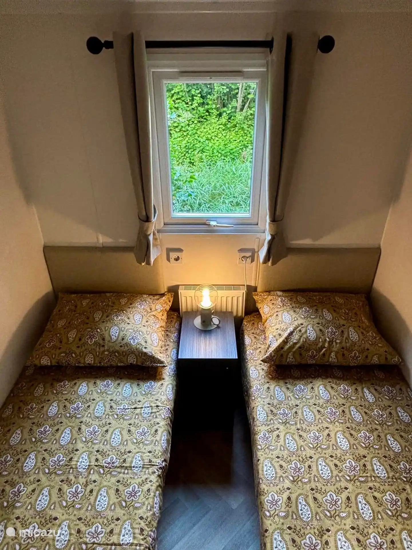 Second bedroom with two single beds.