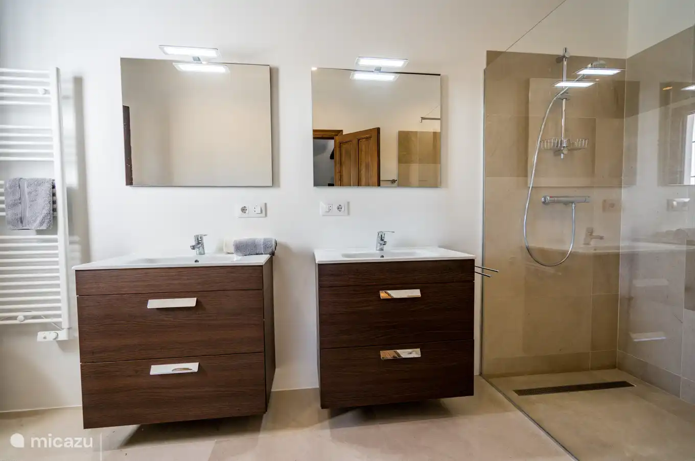 The bathrooms are all equipped with sinks, walk-in shower and toilet.
