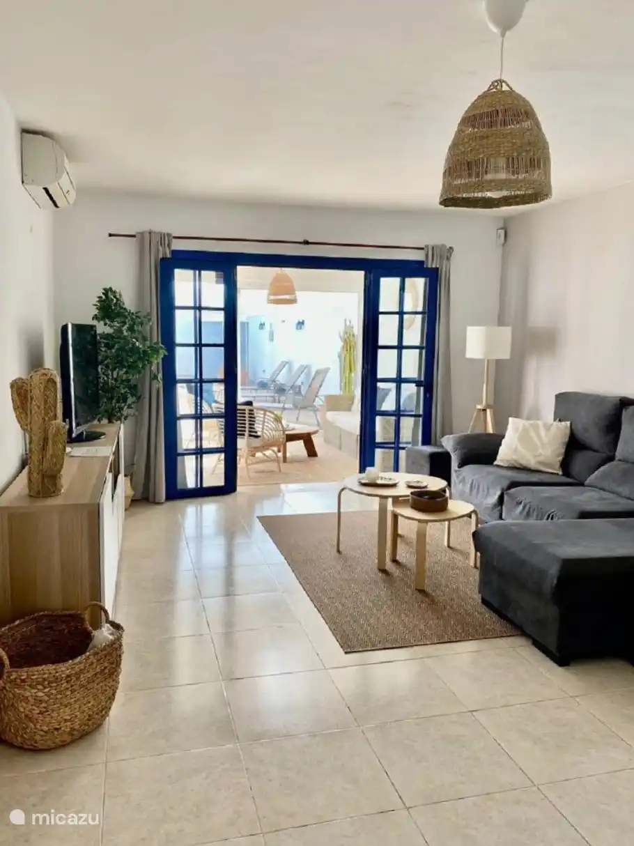 From the kitchen you enter the open plan living and dining area. It has a comfortable sofa, air conditioning and television with international channels. Here is an access to the conservatory via French doors.