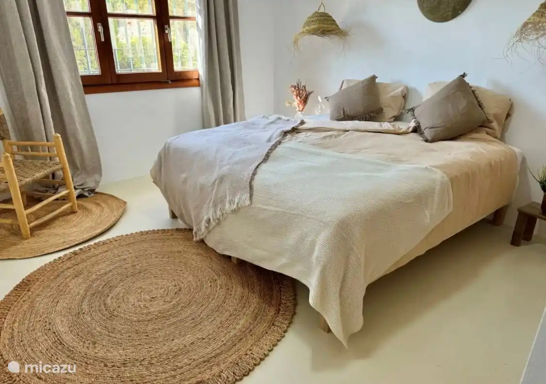 Spacious bedroom with air conditioning, en-suite bathroom and views, a wonderful place to relax.