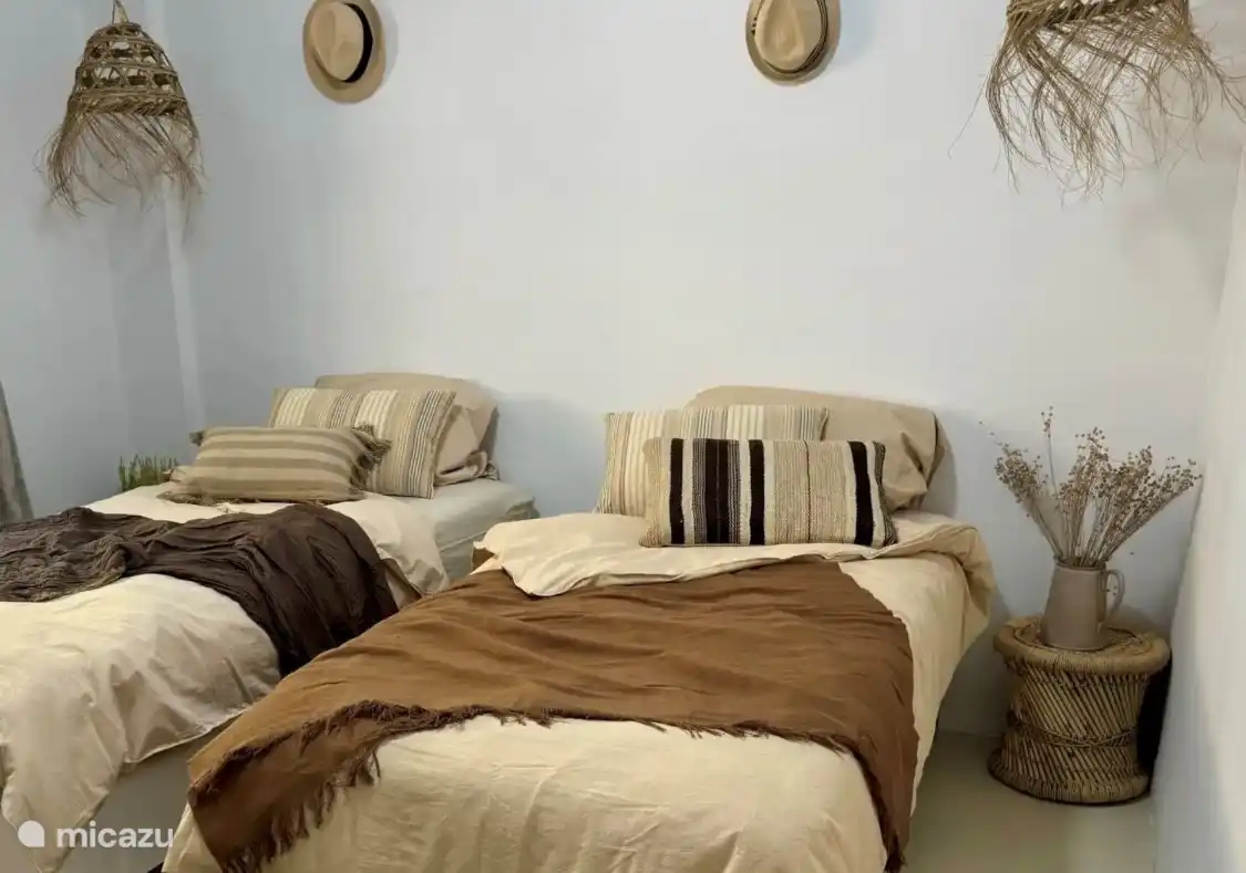 Two single beds that can also be placed as a double bed if desired, comfortable and versatile.