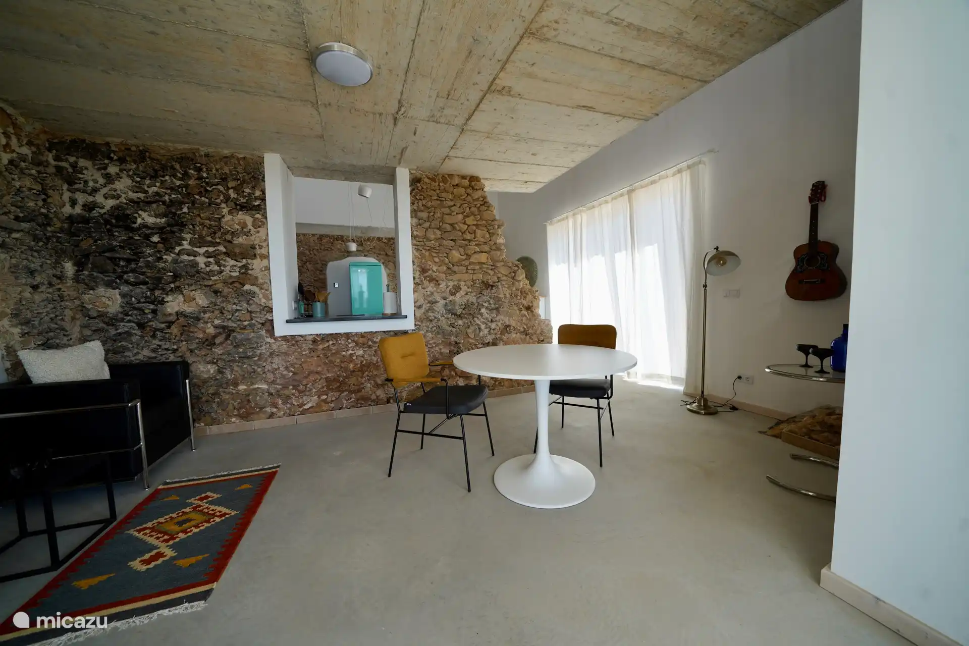 Sitting area and dining table and view to the kitchen