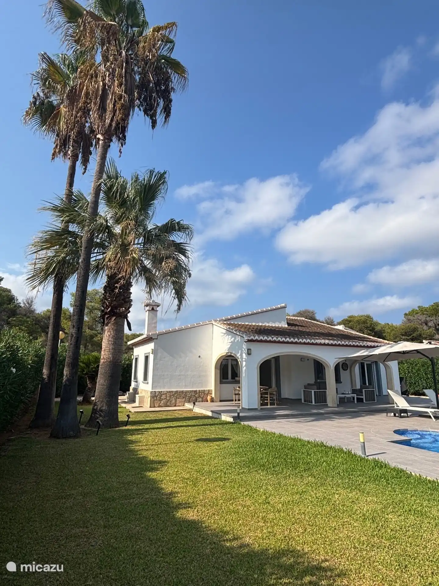 Je hoort het geruis van de palmbomen..