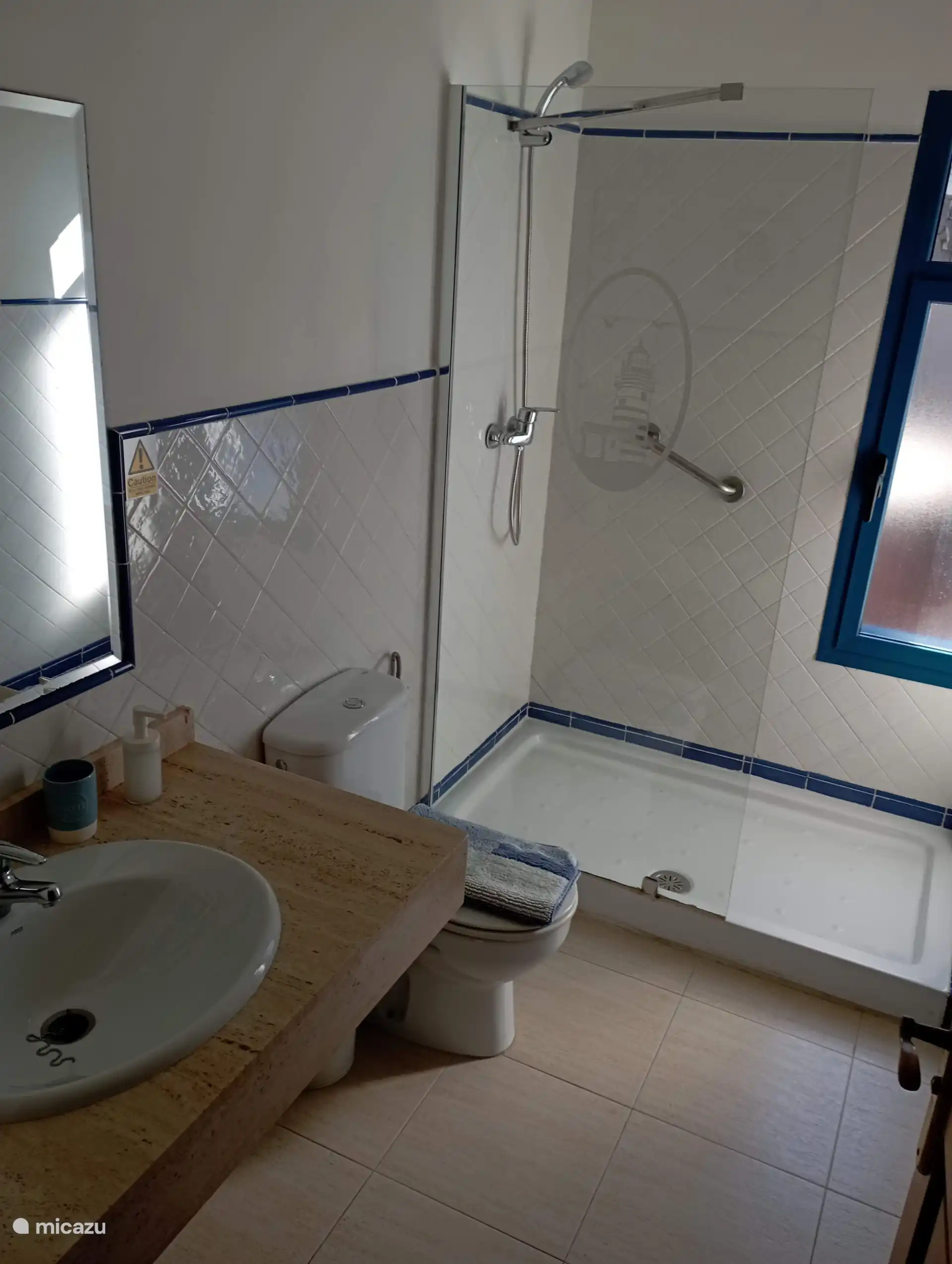 Bathroom with shower, toilet and sink