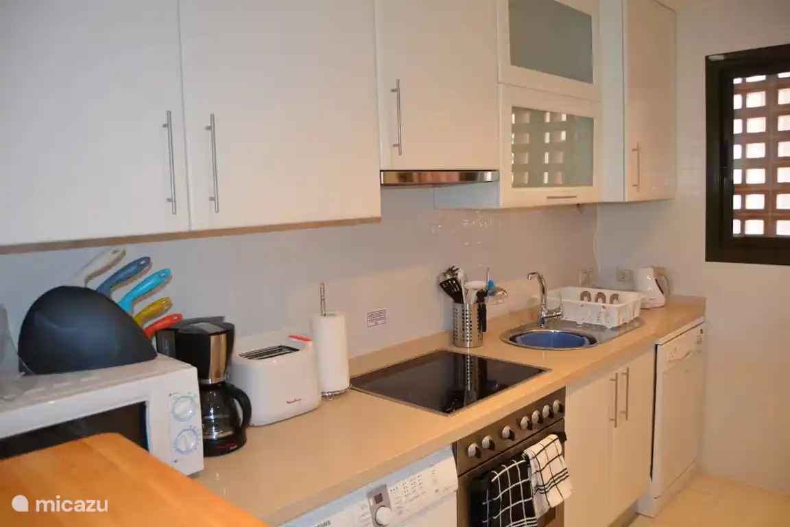 Kitchen with washing machine and dishwasher