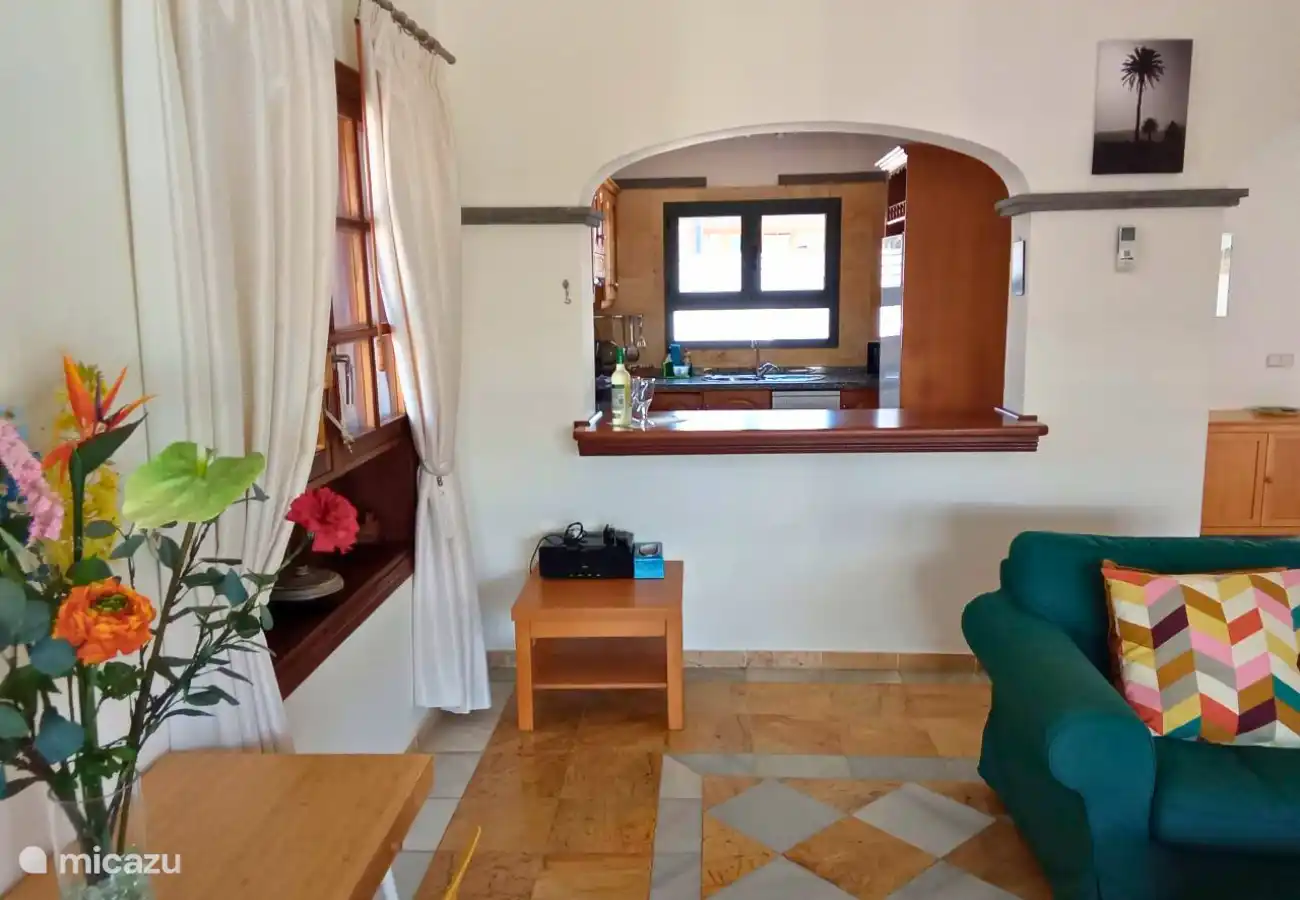 The living room has two comfortable sofas, television with Dutch channels and air conditioning.