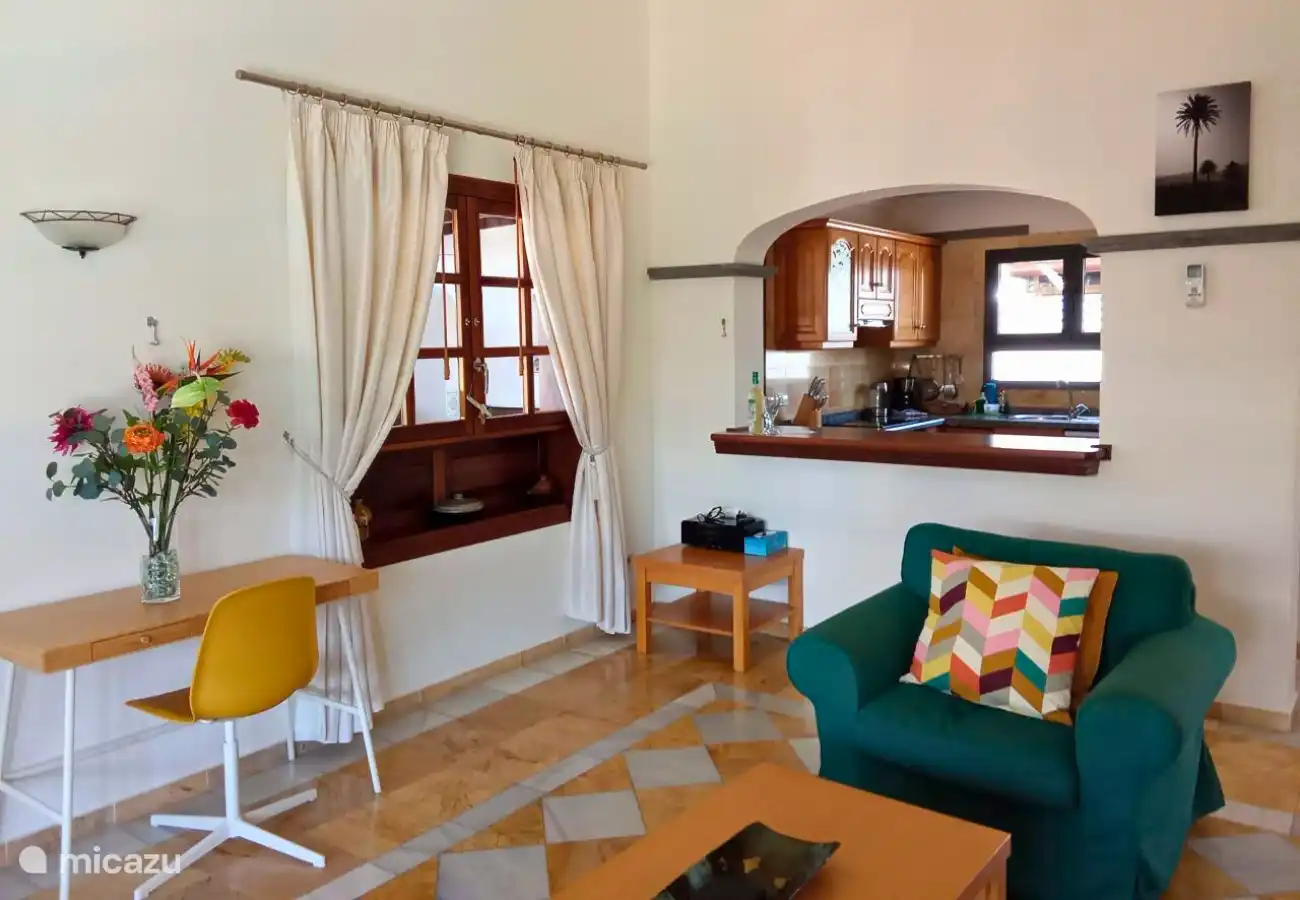 The living room has two comfortable sofas, television with Dutch channels and air conditioning.