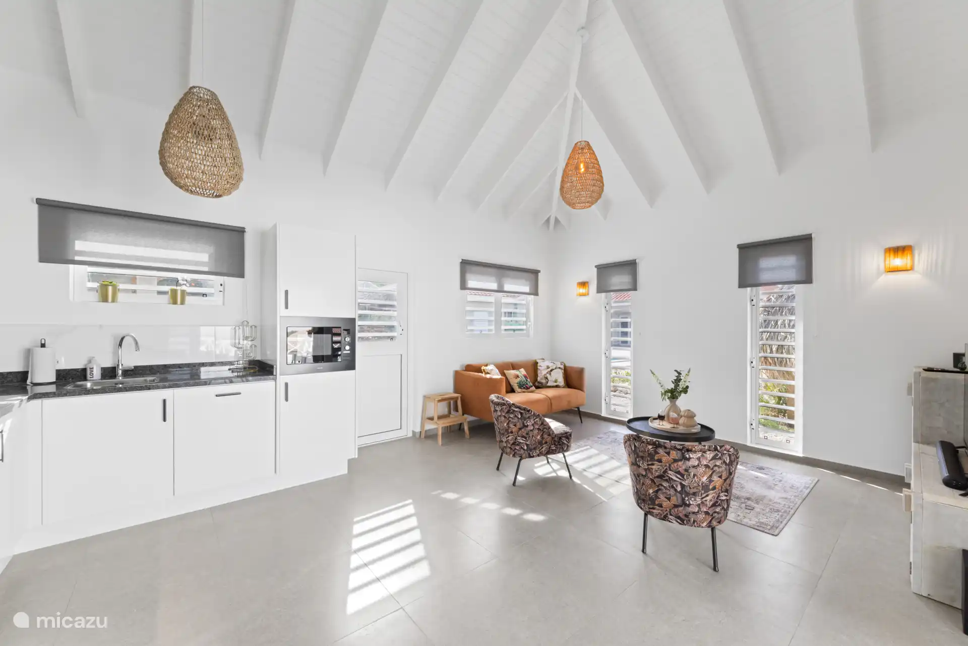 Overview of the open kitchen followed by the sitting area in the living room