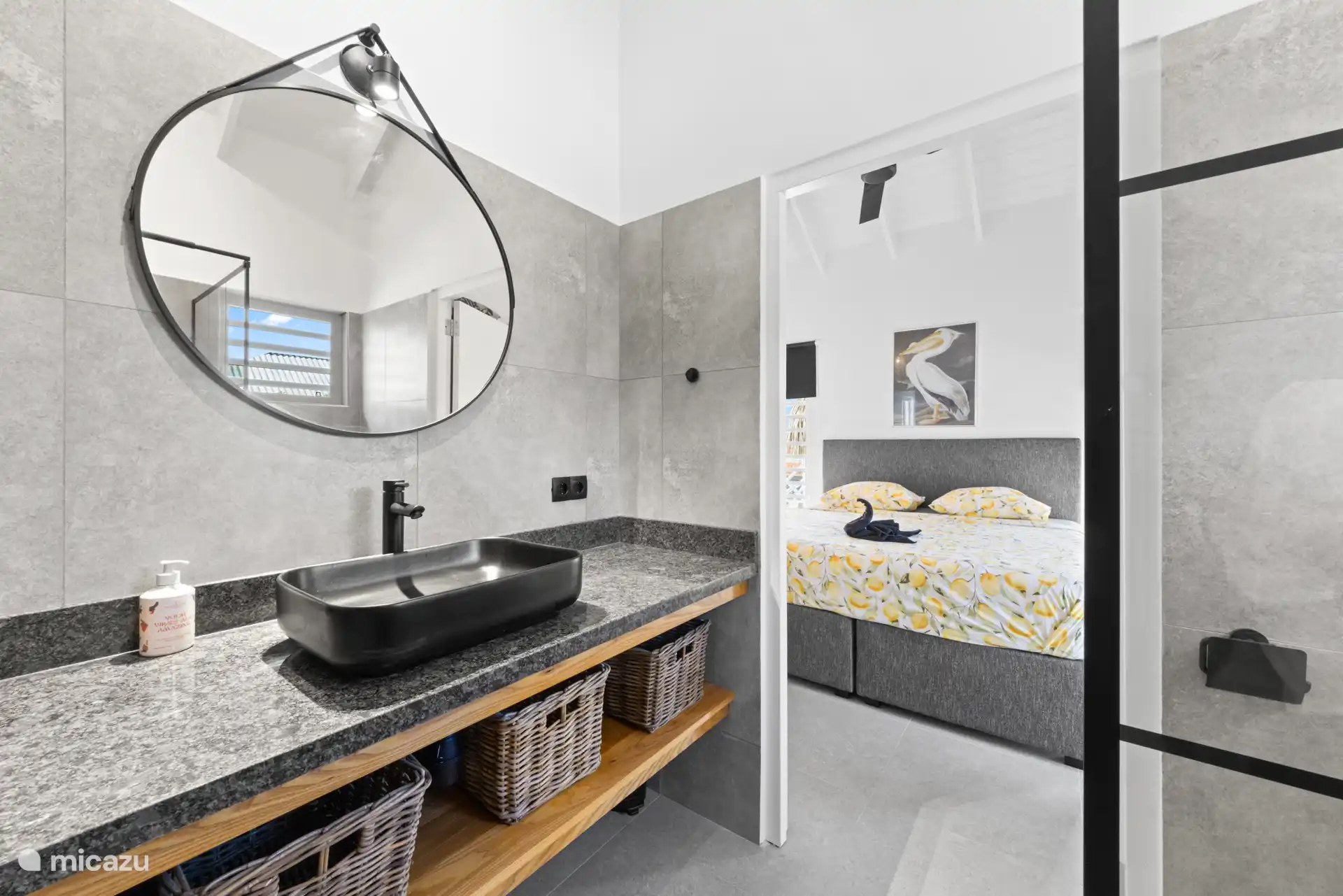 The ensuite bathroom to the master bedroom. Because the top is from the wall and also because of the wooden shelf below, there is a lot of space for storing the toiletries