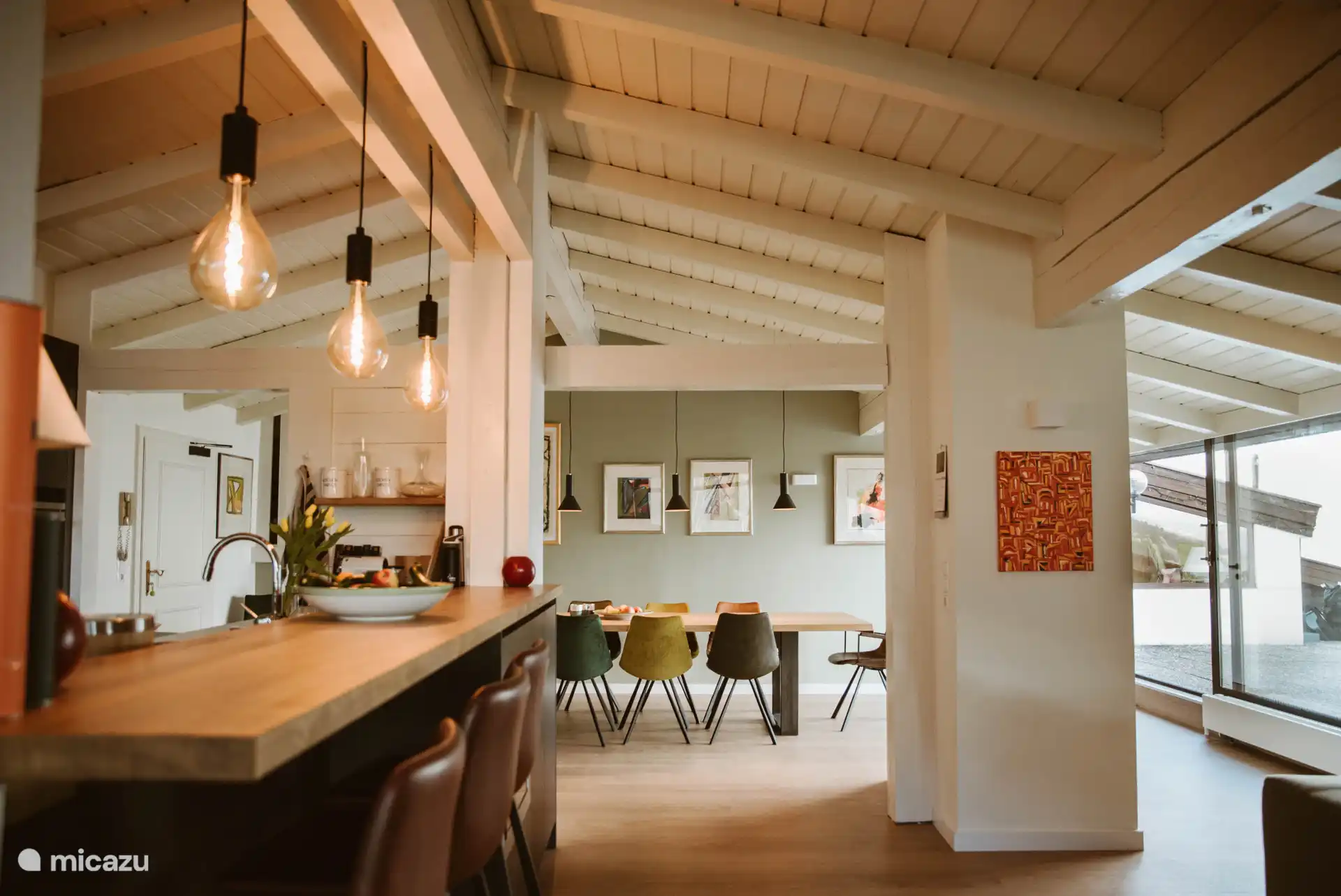 Open kitchen and large dining table with 8 chairs