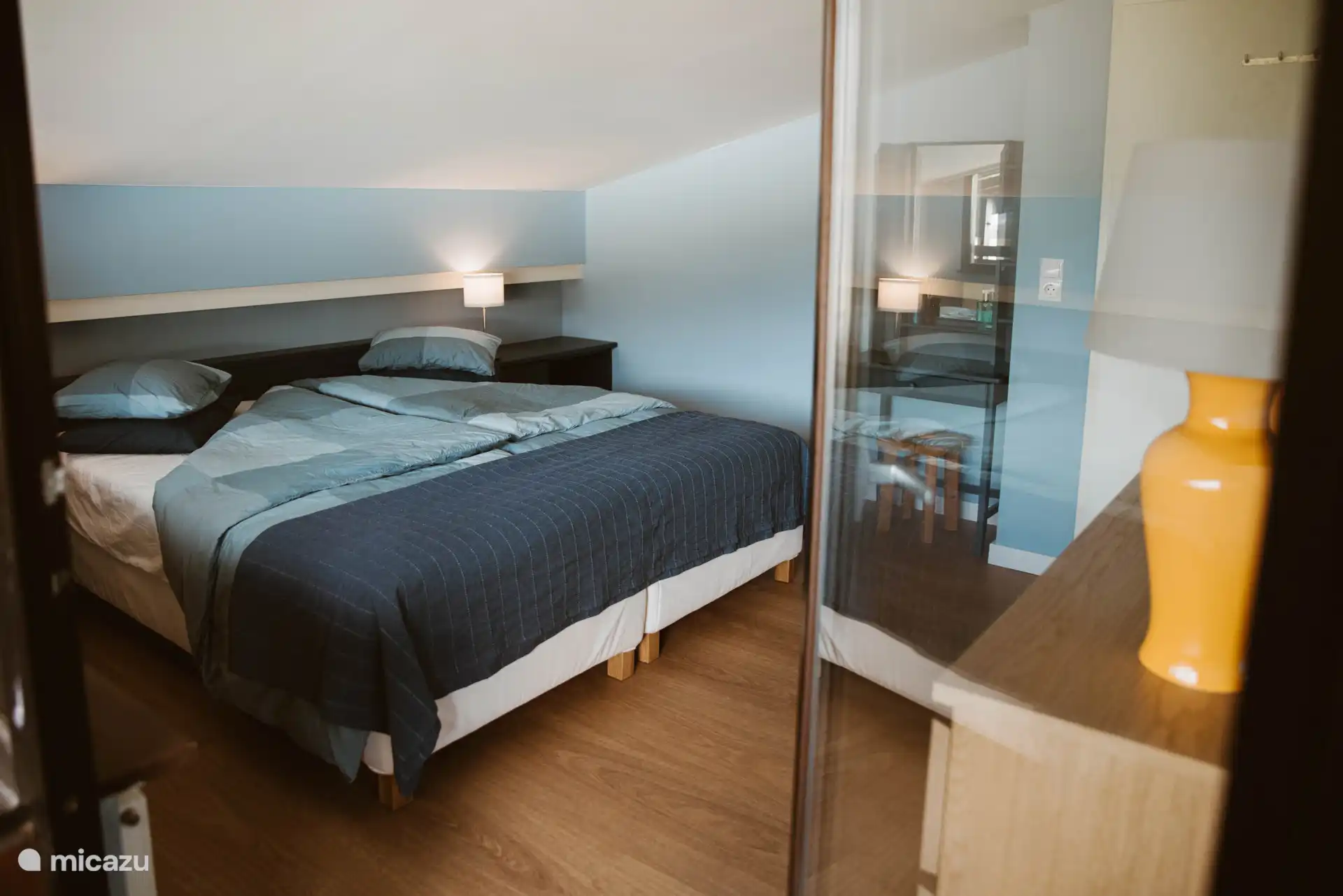 Spacious bedroom with two single beds