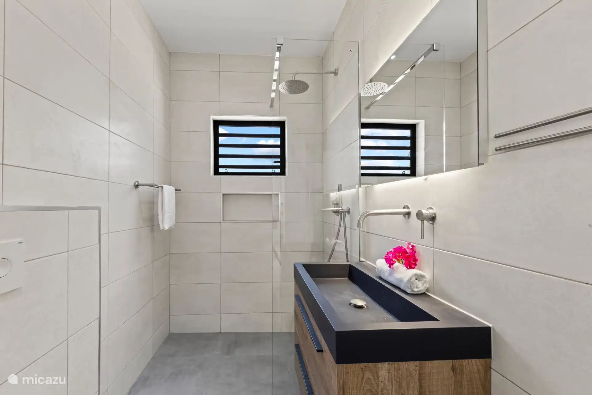 Shared Bathroom: Modern and stylish, shared by bedrooms 2 and 3 for convenience and comfort