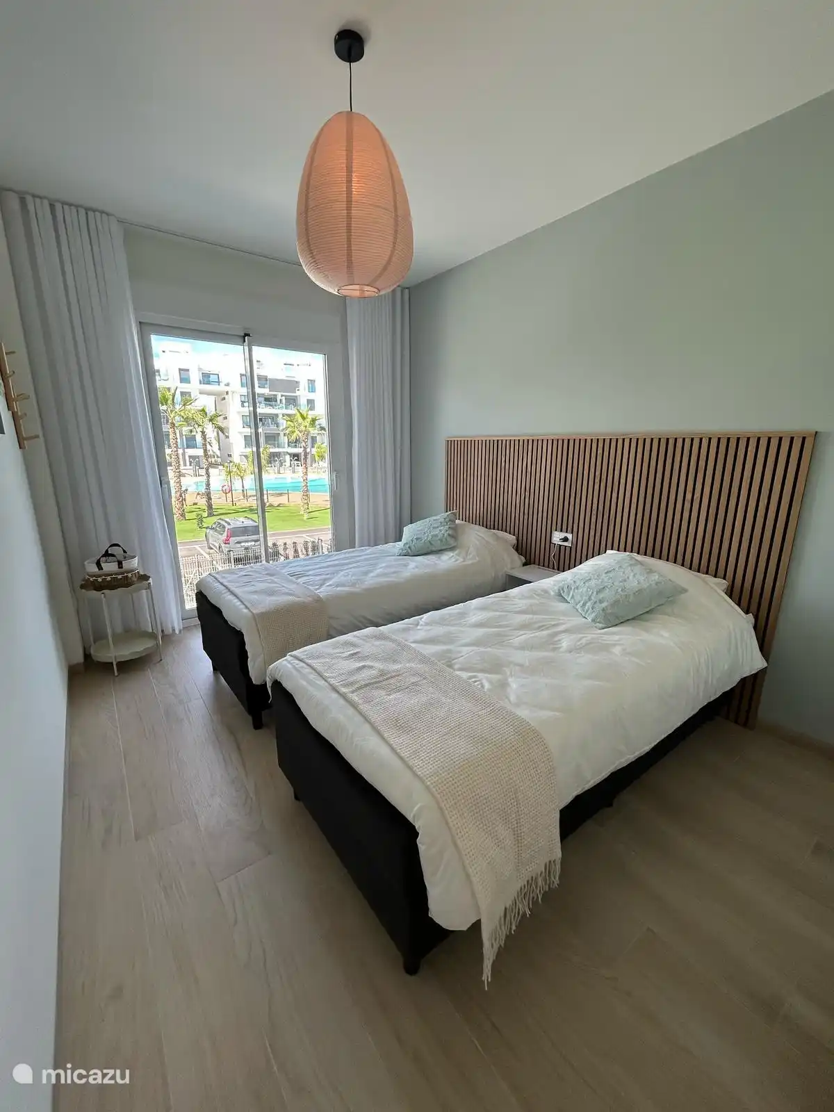 Bedroom with 2 single box spring beds of 90x200
Can be put together to create a 2 person bed. 
Large built-in wardrobe available 