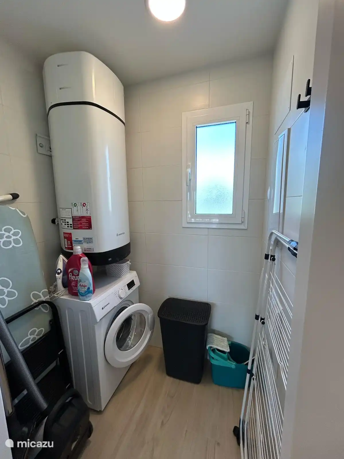 Washing machine room with hot water boiler, fuse box, vacuum cleaner, ironing board/iron and drying rack.
Beach equipment provided: beach chairs, umbrella and cooler.