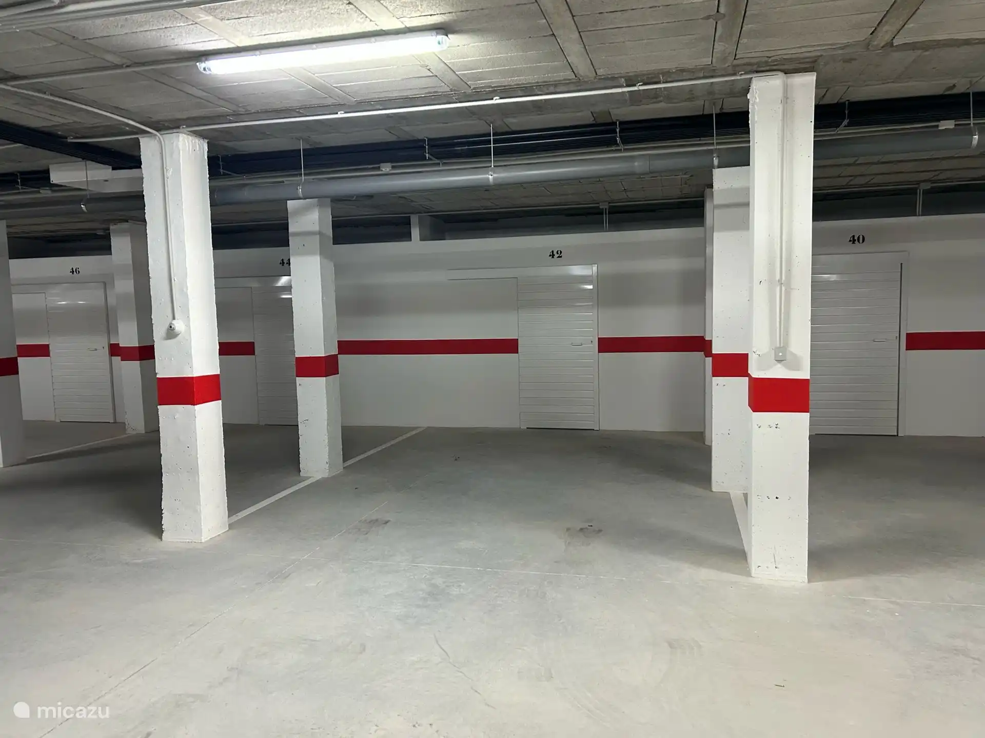 Underground parking with private parking space. Along the elevator that leads directly to the 1st floor in front of our apartment 