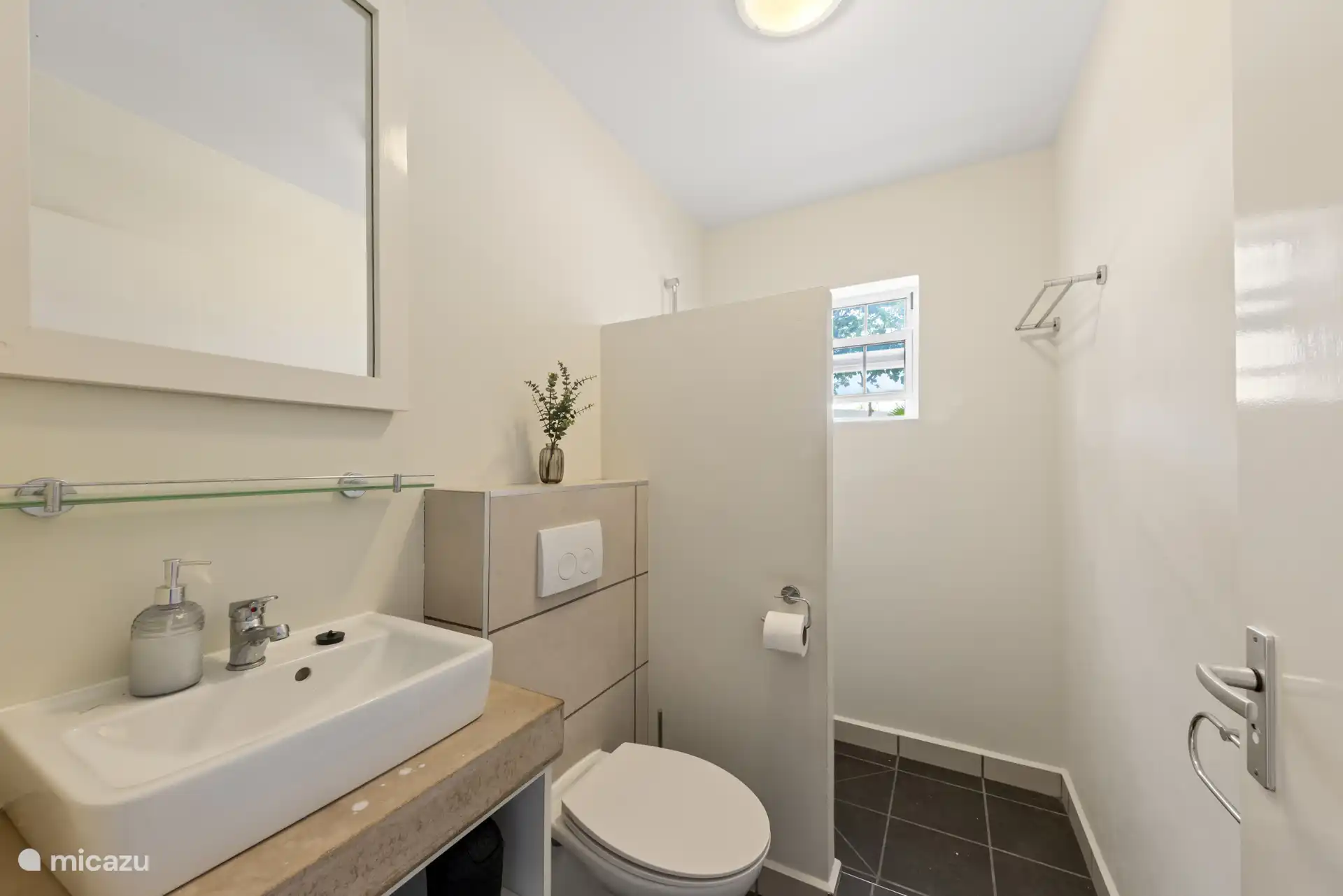 Bathroom with nice shower, toilet and sink