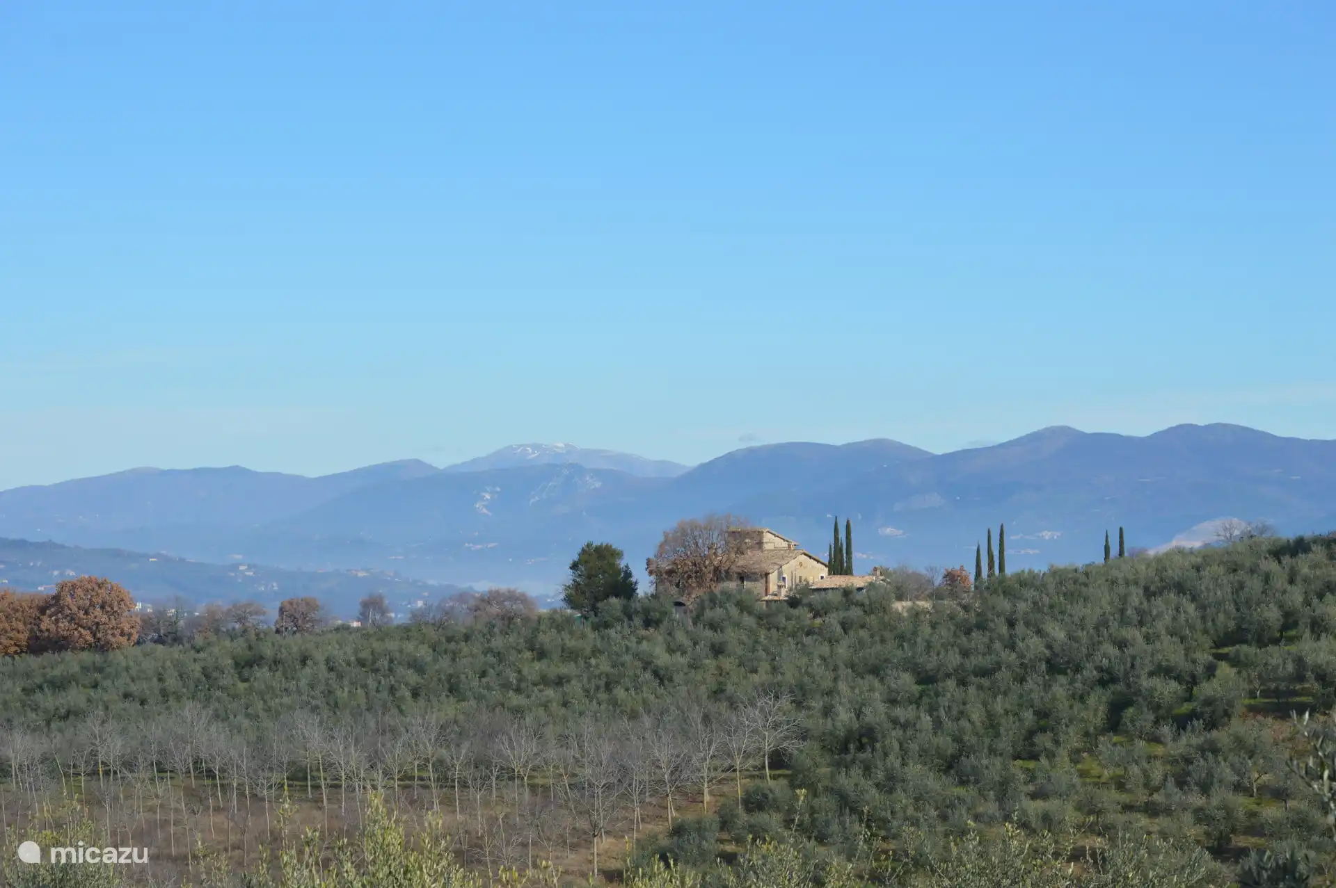 Wide view of the mountains and the valley.
Much more beautiful in real life.  You must have seen it.