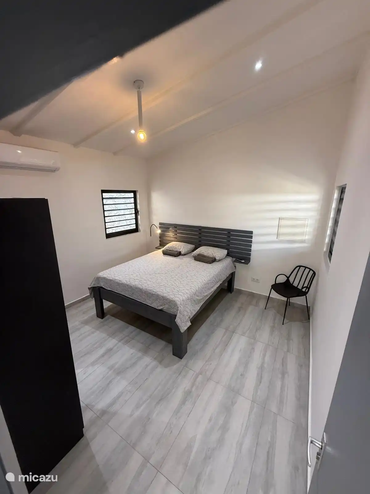 Spacious and bright bedroom on the wind.