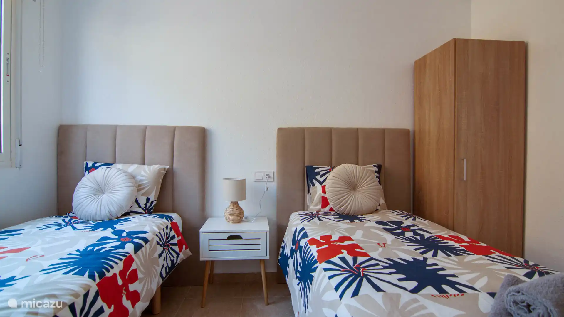 Cozy room with two separate beds, perfect for a comfortable stay