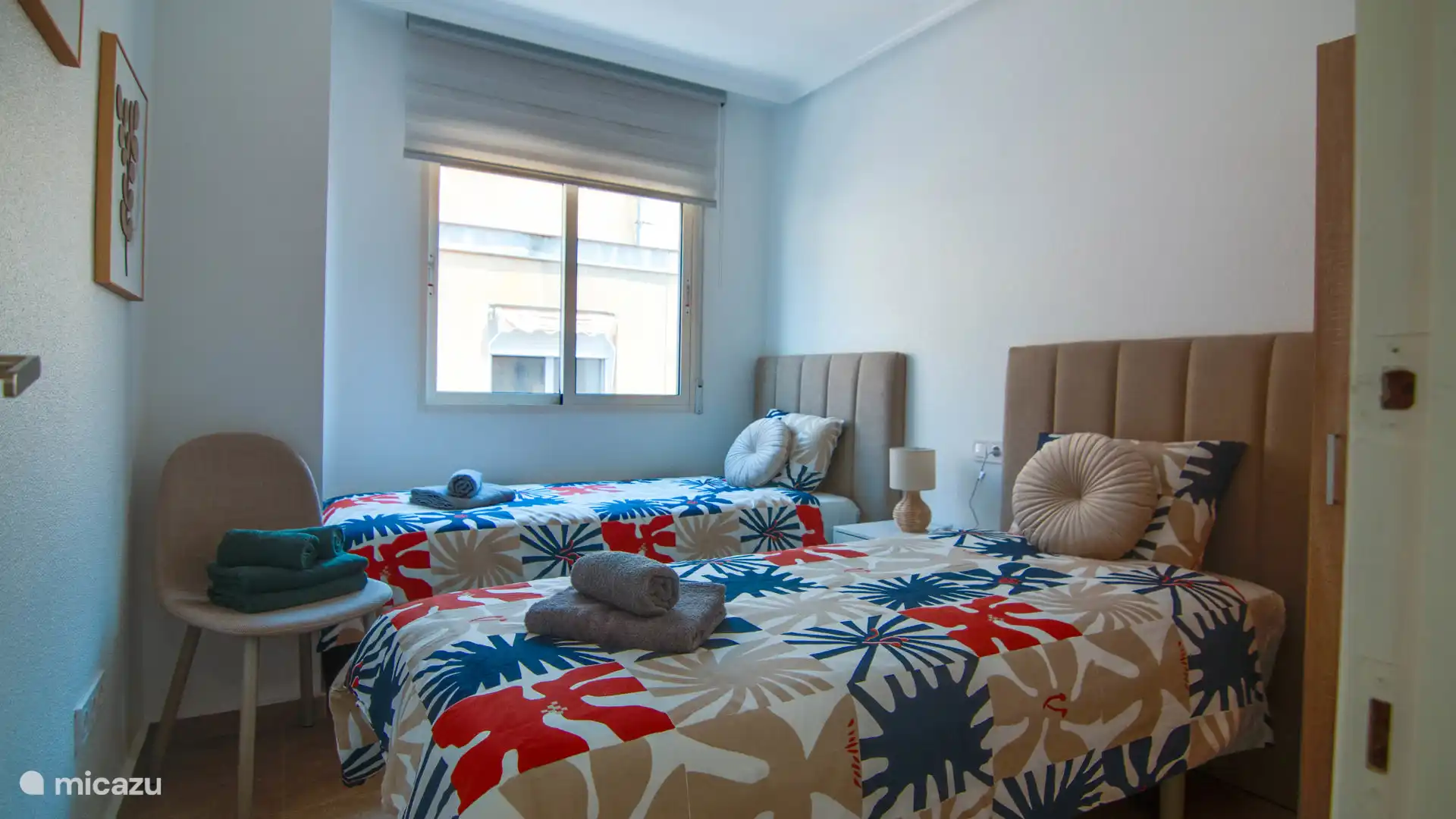 Cozy room with two separate beds, perfect for a comfortable stay