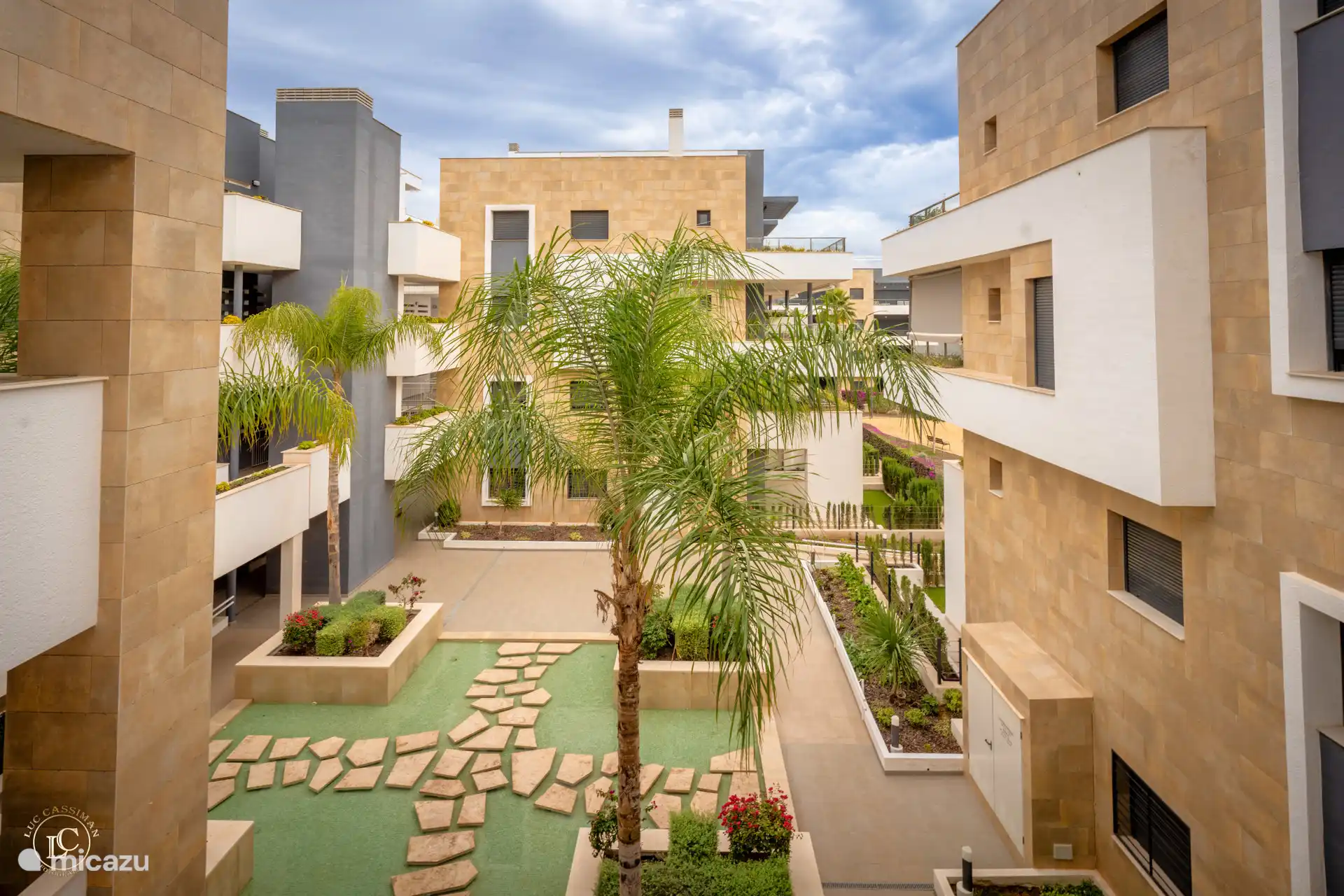 an impression of the buildings and gardens in Flamenca Village