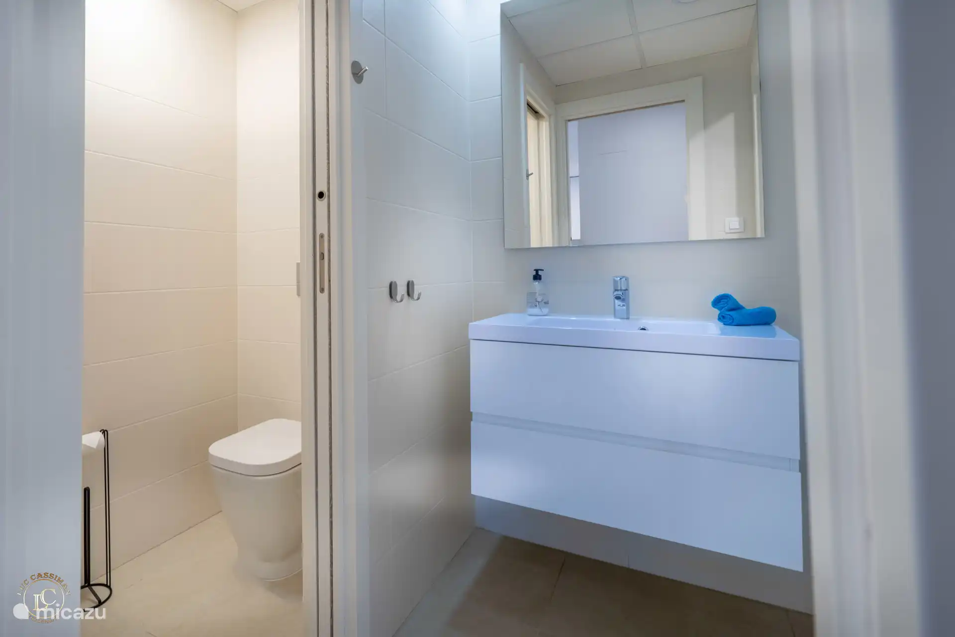 bathroom with 3 separate (lockable) rooms: toilet, sink, shower.