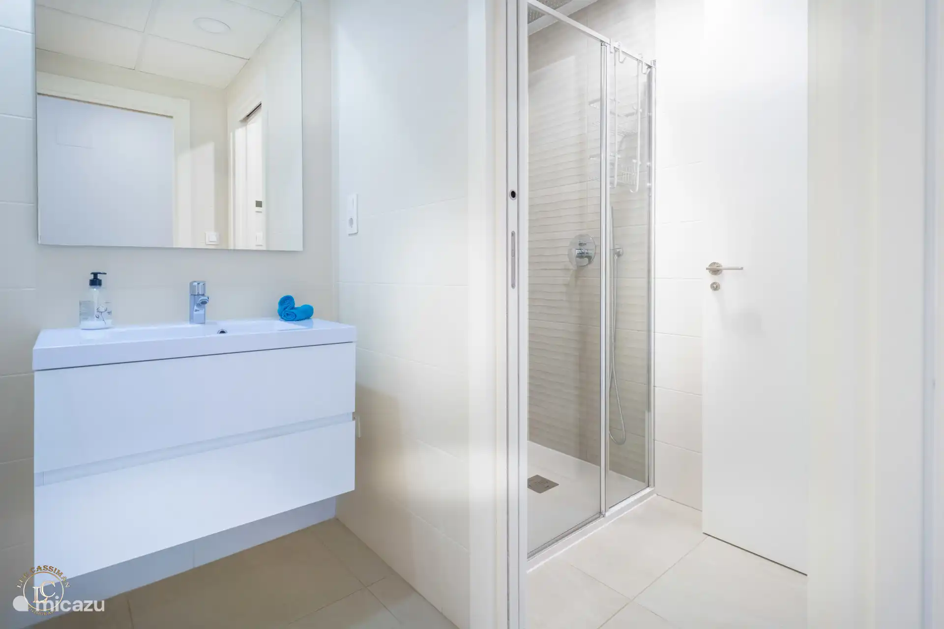 bathroom with 3 separate (lockable) rooms: toilet, sink, shower.